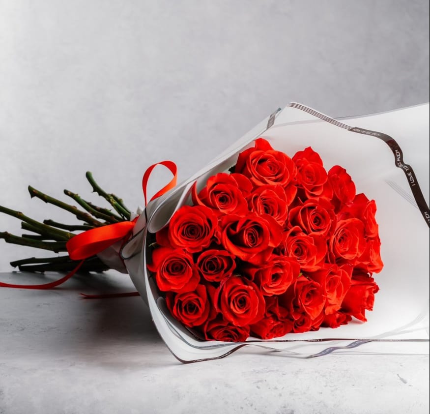 Love in Red Bouquet - Simply but elegant. Go classic with this bouquet!  24 red roses and white wrapping paper   Handcrafted with love by Pétale de Rose  Same-day delivery available in Houston &amp; Katy