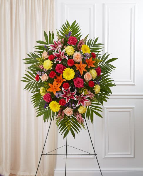 Bright Standing Spray-Small - Standing spray arrangement with bright, mixed colors accented with soft, lush greenery