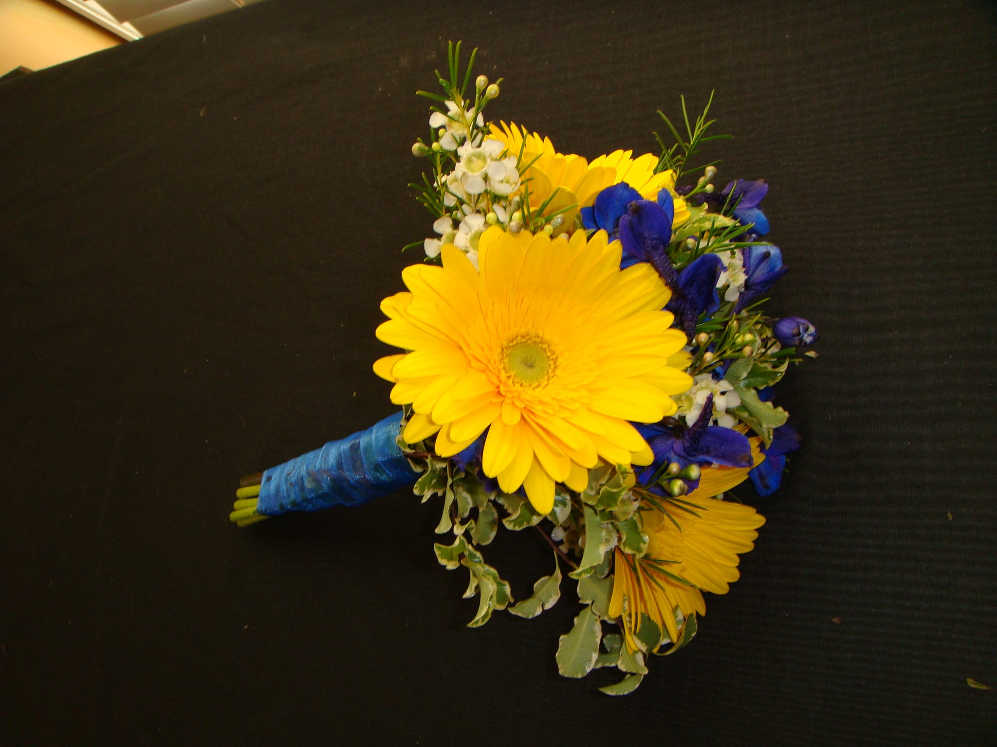 Hand Tied Bouquet With Yellow Gerber Daisies - Hand Tied Bouquet with yellow gerber diaises, greenery, filler and ribbon.