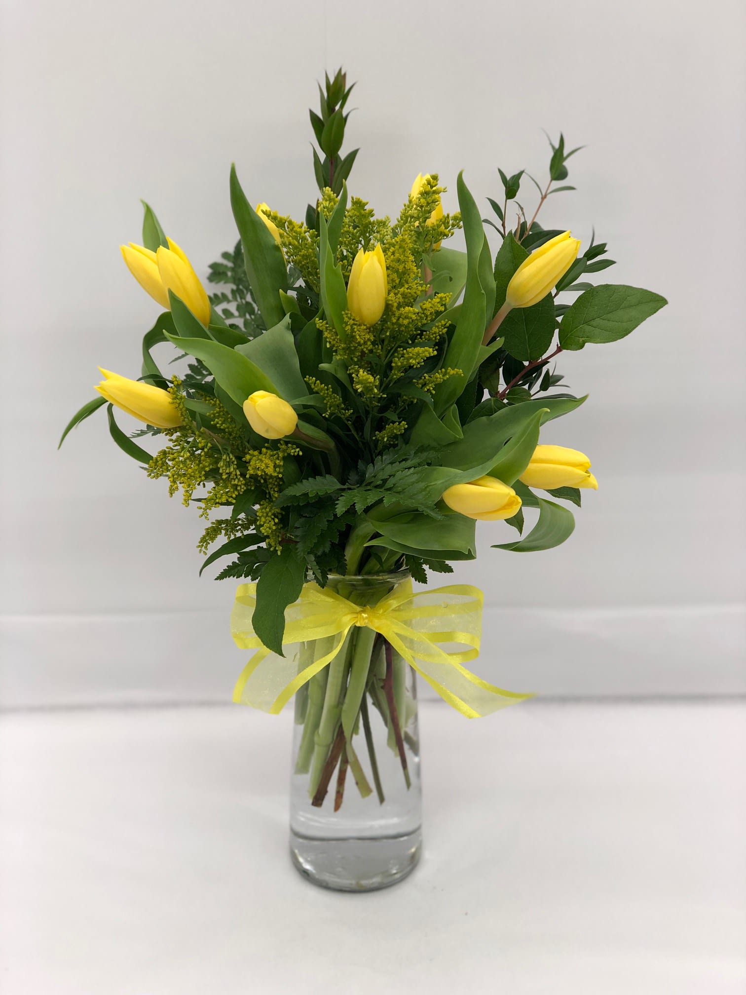 Yellow Tulips - Local Delivery Only  - LOCAL DELIVERY ONLY; Local delivery is limited to Austell, Mableton, Marietta, Smyrna and Vinings.  Fresh tulips, beautifully and artfully arranged by one of our talented designers. Filler flowers and greenery may vary.  10 STEMS AS SHOWN