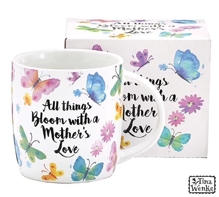 MUG ALL THINGS BLOOM WITH A MOTHERS LOVE - Details: Dishwasher safe/FDA approved/Microwave safe.  Multi colored butterflies all around the message: All things bloom with a mother's love. Has white interior.  Made of porcelain. Individually gift boxed.  4 1/4" H x 4 1/2" W x 3 1/4" D. Holds 12 oz.