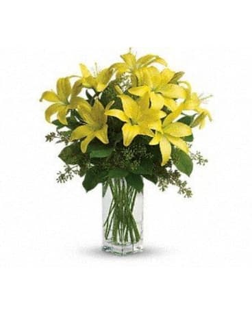 Lily Sunshine - Pure sunshine! Send sunny thoughts someone''s way with this summery bouquet. Rich greenery surrounds warm yellow lilies long a symbol of friendship and commitment. A pretty pick for those who prefer single flower arrangements. Bright yellow asiatic lilies are surrounded by green salal and seeded eucalyptus in a tall square vase. Vase may vary slightly from pictured vase. Approximately 16 1/4" W x 20 1/4" H.  Standard - 6 Stems Deluxe - 9 Stems Premium - 12 Stems   FCT140-2A