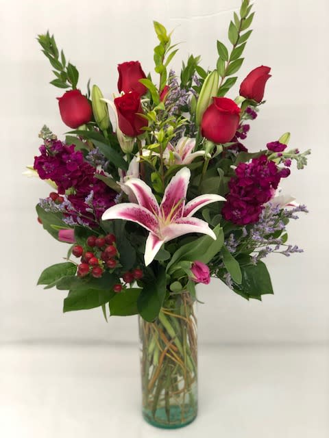 Wildberry Bouquet  - Beautiful vibrant berry colors arranged in a tall romantic bouquet.  Stargazers, roses, stock, tulips and filler.  Flowers and colors may vary depending on availability. 