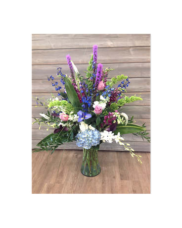 Magnificent Blooms Bouquet - Iris, blue delph., roses, liatris, snaps, bells of Ireland, orchids, hydrangeas, berries, mini calla lilies and more...  Flowers and colors may be substituted depending on availability and season.   FCF-073