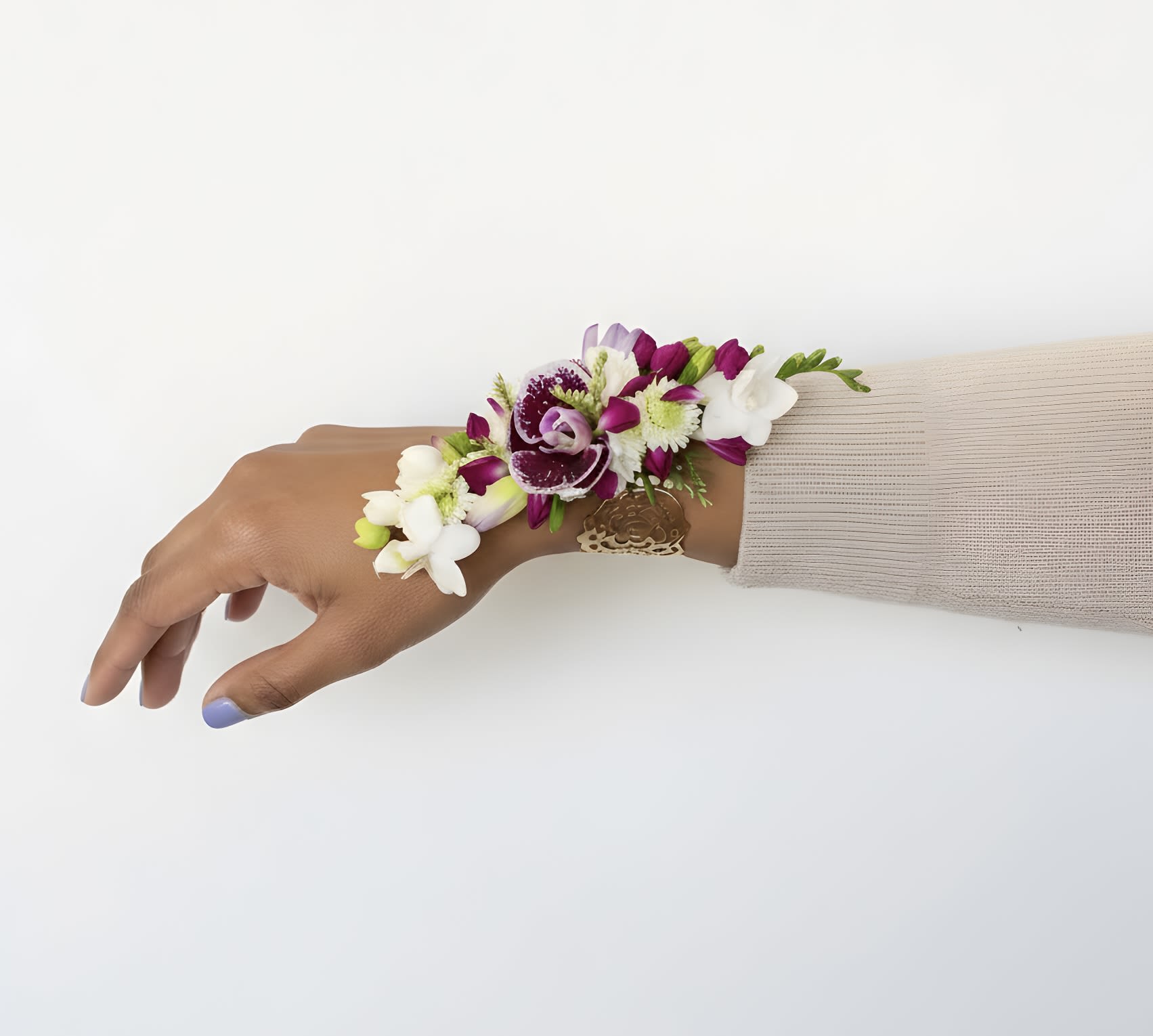  Prom Corsage (Requires 48 Hour Notice)  - Make a statement with this stunning handcrafted corsage, designed with a vibrant mix of fresh orchids, freesias, and accent florals. Whether for prom, a wedding, or a special occasion, this wrist corsage adds a touch of elegance and sophistication to your look. Secured on a comfortable, stylish band, it complements any attire while showcasing natural beauty.   Perfect for:  Proms &amp; Homecomings  Weddings (Bridesmaids, Mothers of the Bride/Groom)  Formal Events &amp; Galas  Special Celebrations