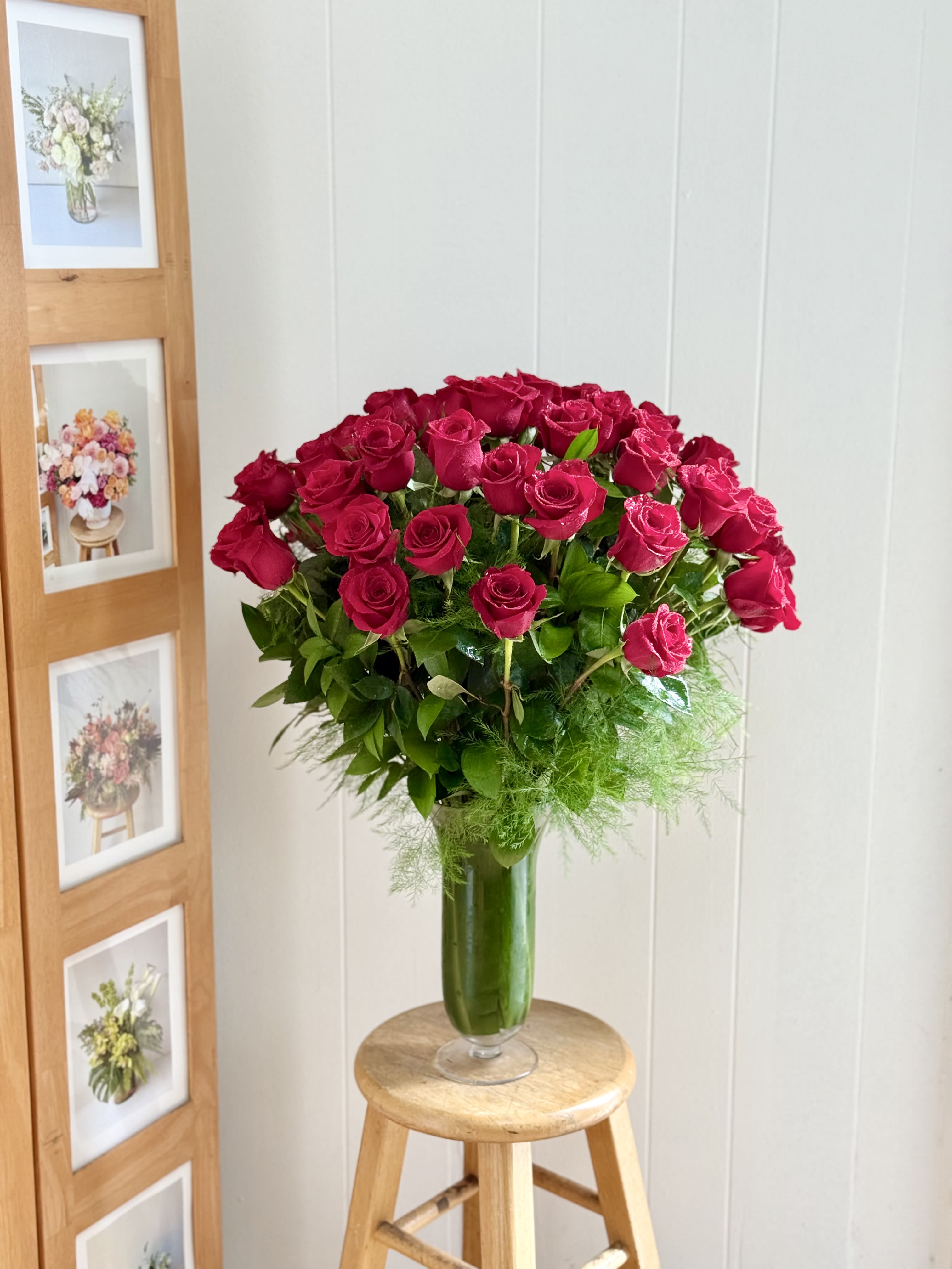 EC122 - Madly in Love (50 stems long stem Red rose) - Surprise your loved one with our stunning 50 long  stems of red rose arrangement in a tall glass vase! This romantic arrangement is perfect for Valentine's Day, anniversary celebrations, or any occasion that calls for a grand gesture of love.  Our expert florists hand-select the freshest and most vibrant red roses and arrange them in a tall glass vase to showcase their beauty. The red roses are arranged in a tall glass vase. The color red is often associated with love, passion, and romance, making it a popular choice for Valentine’s Day, anniversaries, and other special occasions. 