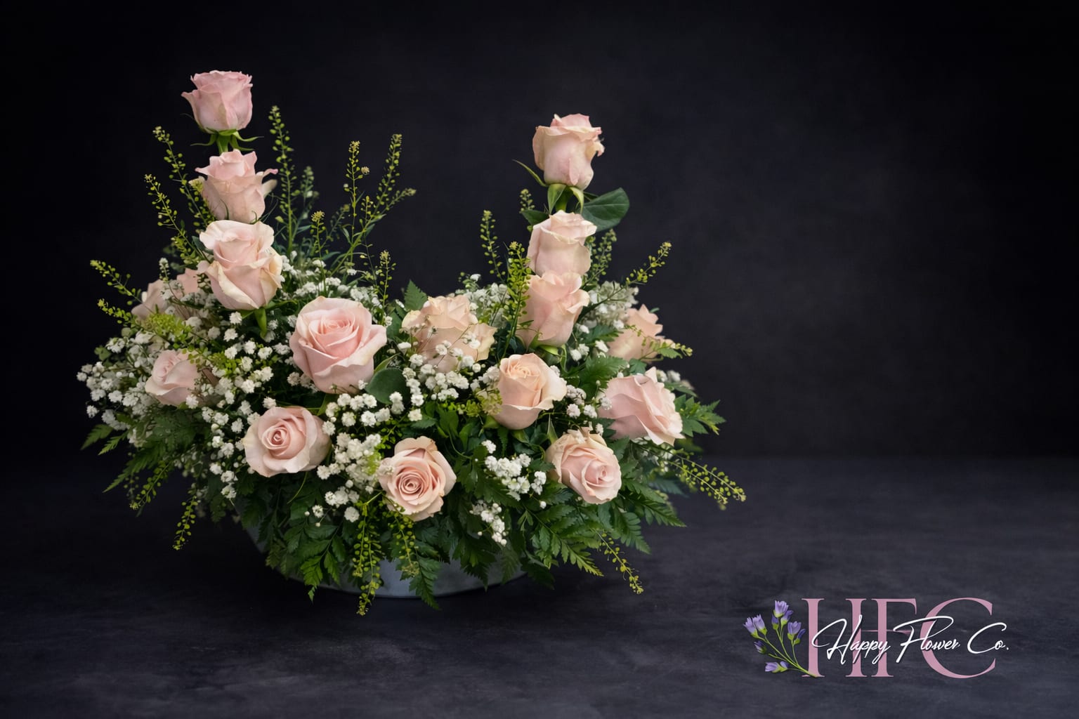 Pink sympathy  - Pink roses, babies breathe and greenery for an Urn