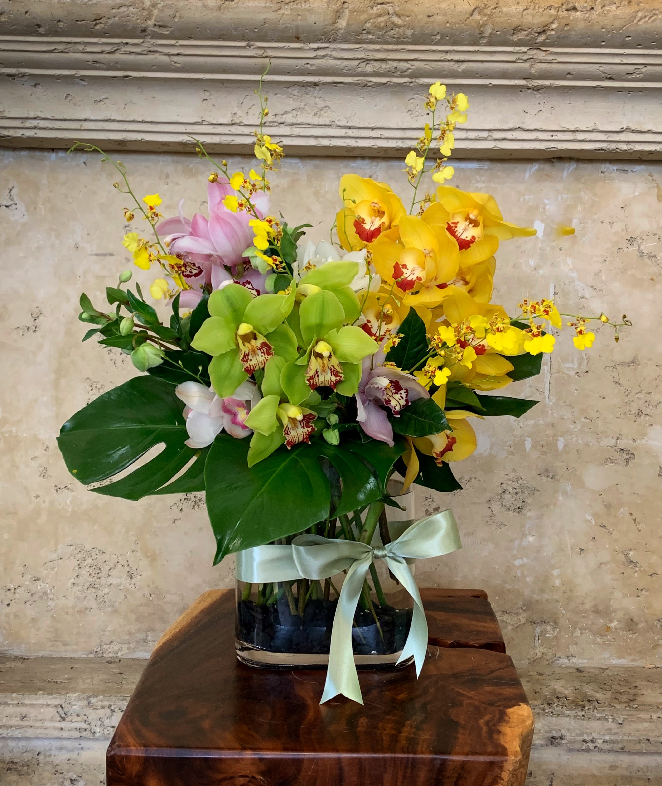 New Zealand Orchid - Premium Cymbidium Orchid and nice green leaves in glass vase.