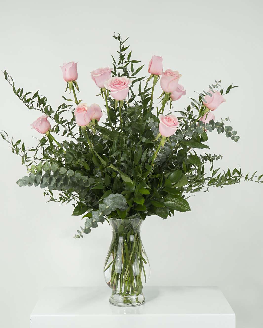 Embrace  - Twelve light pink roses that will softly warm the home, heart and soul. 
