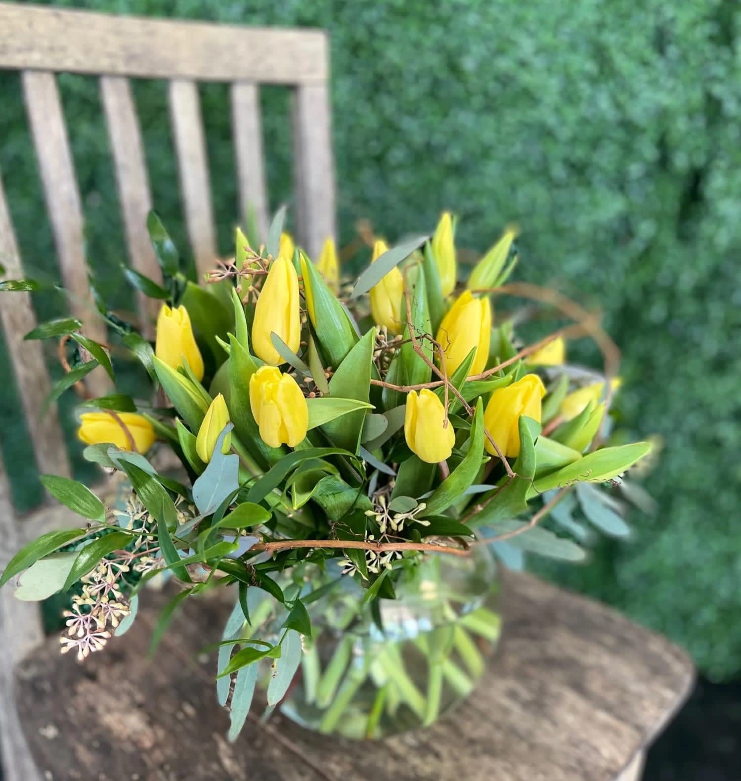 Spring Has Sprung - This striking rose bowl brimming tulips is sure to bring a smile to anyone's face. Complete with seasonal texture and foliage, the tulips are available in a variety of colors, Available in Yellow, Pink, Red, Lavender, White and Mixed.  