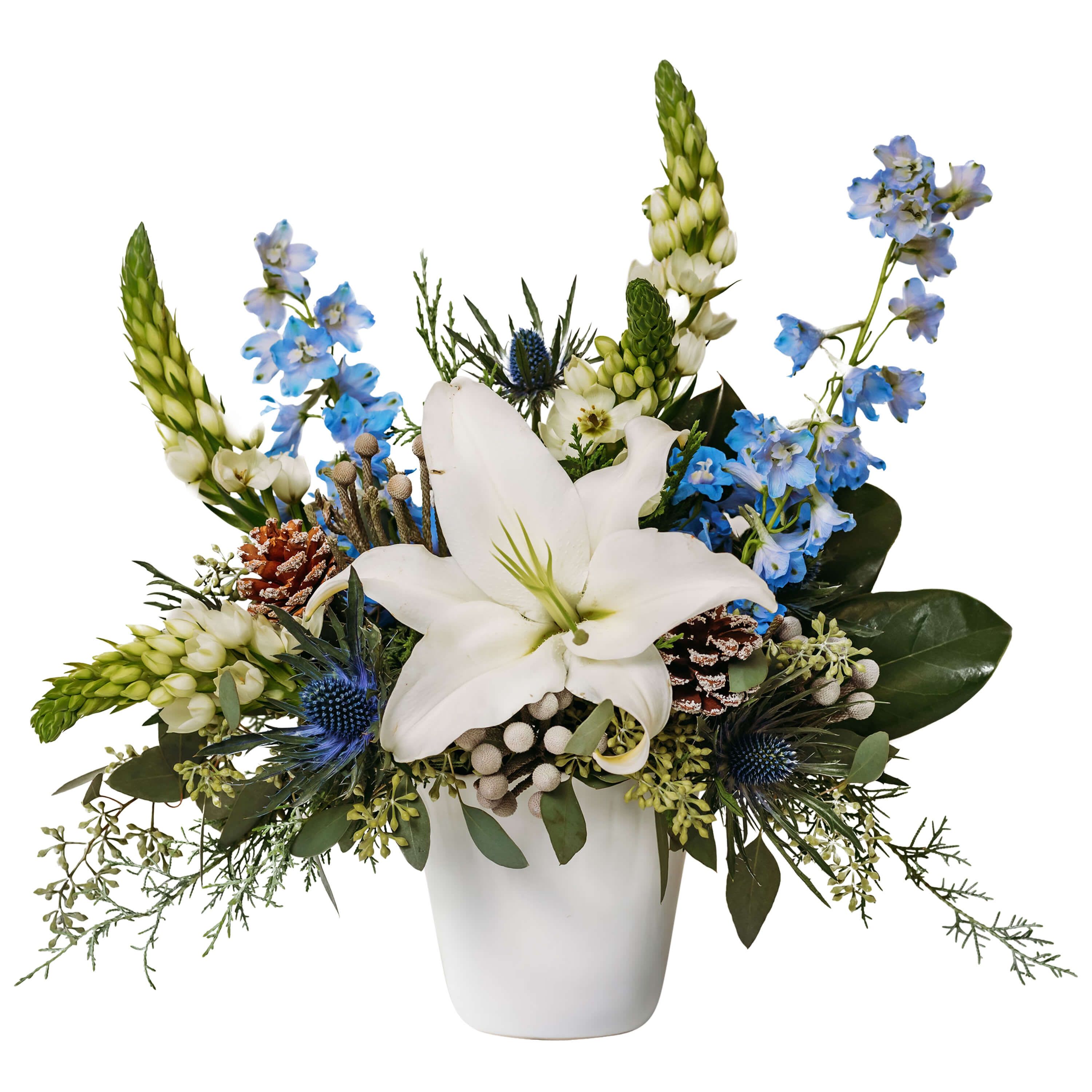 Aquamarine - As calm and relaxing as a coastline. Aquamarine will add charm and elegance to any spot. A white lily is wrapped with Delphinium and Star of Bethlehem in this stunning design.    Approximately 18"W X 17"H