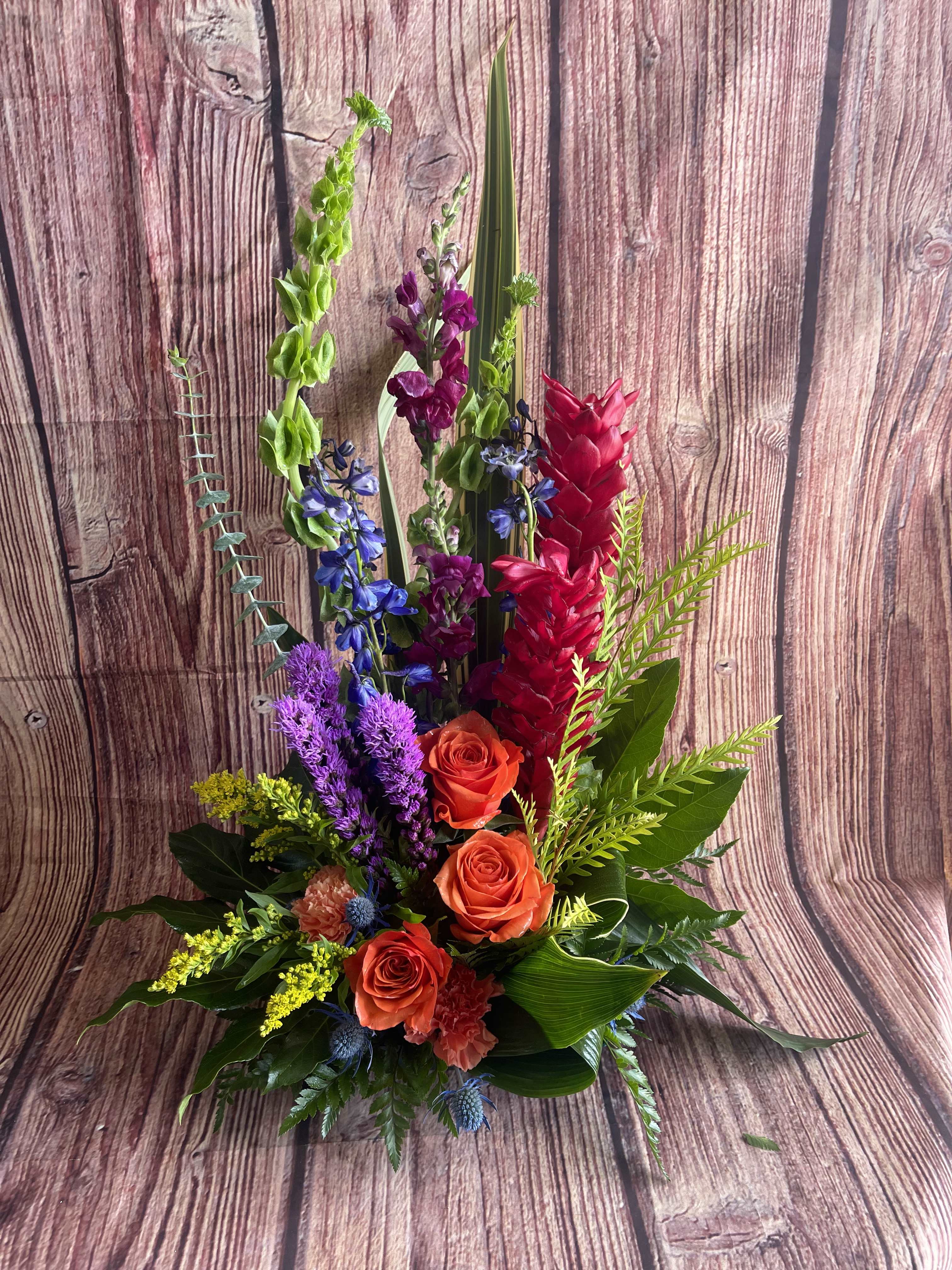 Boasting Beauties - Vibrant fresh blooms boast their beauty, Curly willow &amp; greens accent a variety of in season vibrant flowers. Tropical flowers will be selected based on availability. (All designs are arranged as similar as possible. We promise to keep the same color, style, and overall theme with what Mother Nature generously blesses us with. Certain tropical flowers may not be available for same day delivery.)