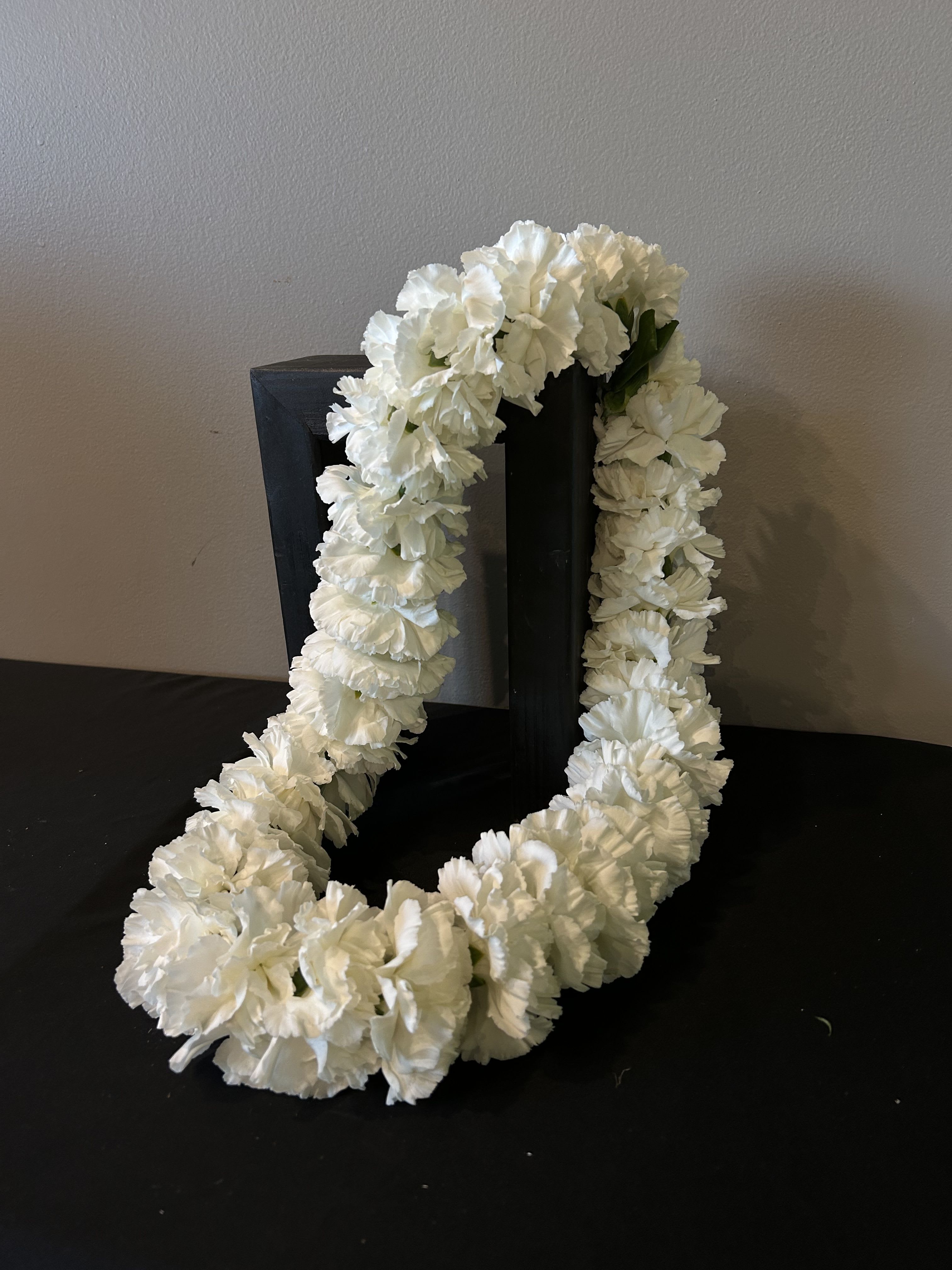 Carnation Lei - Lookinig for a unique Lei? Order one of our in house Carnation Leis for your graduation or special event! Please indicate what color carnations you'd like your Lei or call our shop today for color options! 