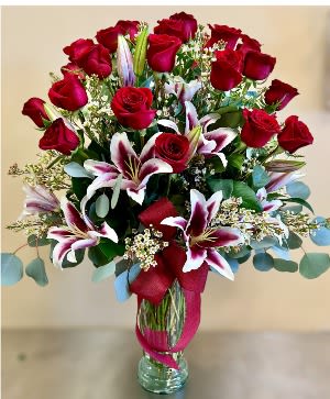 Two dozen rose and lily - 2 Dz. long-term roses arranged in a glass vase with stargazer lilies, baby breath, and greens