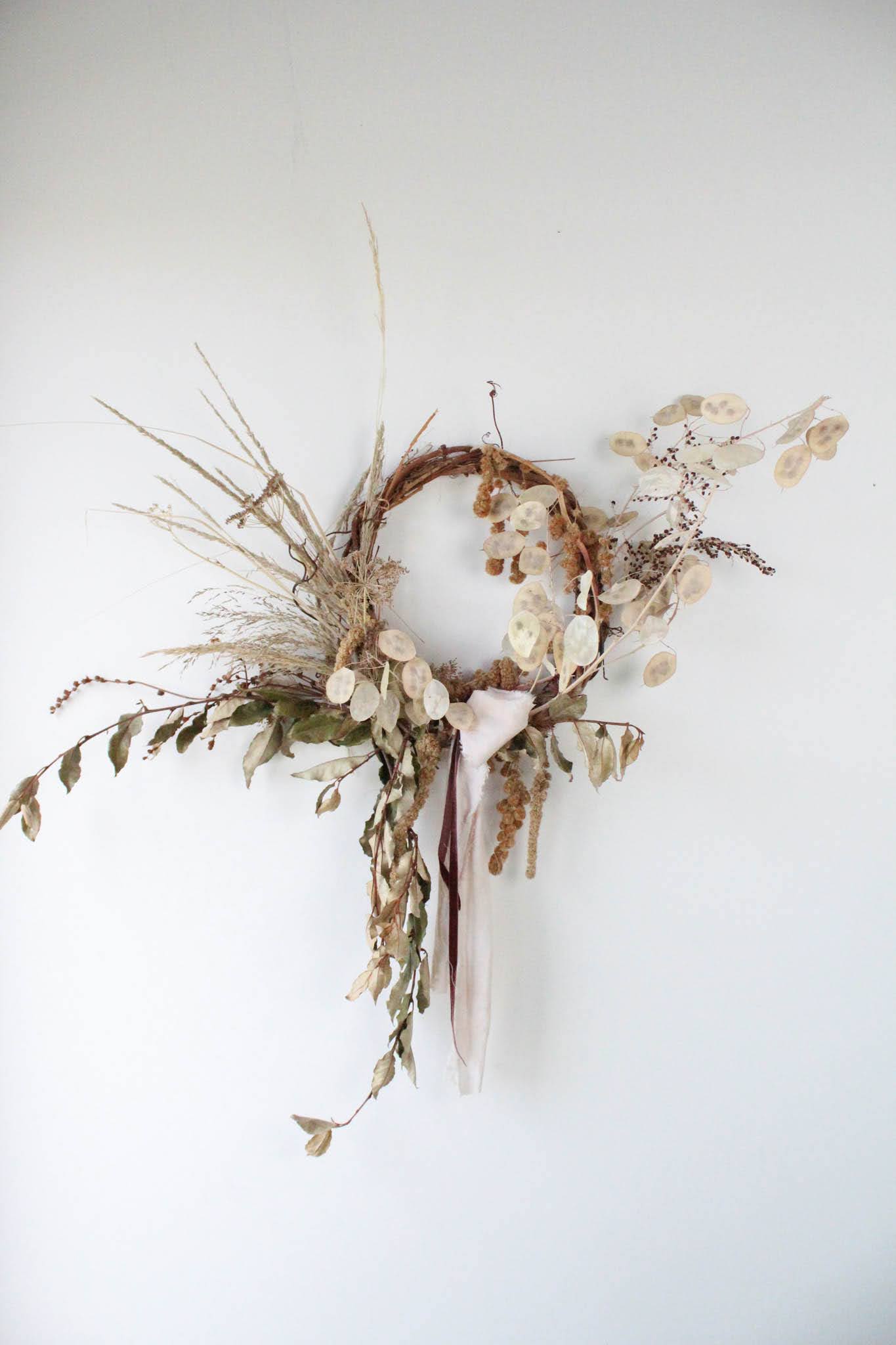 Dried Lunaria Wreath  - The perfect wreath to accent any door or wall.  *Images are a representation of our design style. Each arrangement is made to order and flower selection will vary due to product availability the week of your order.