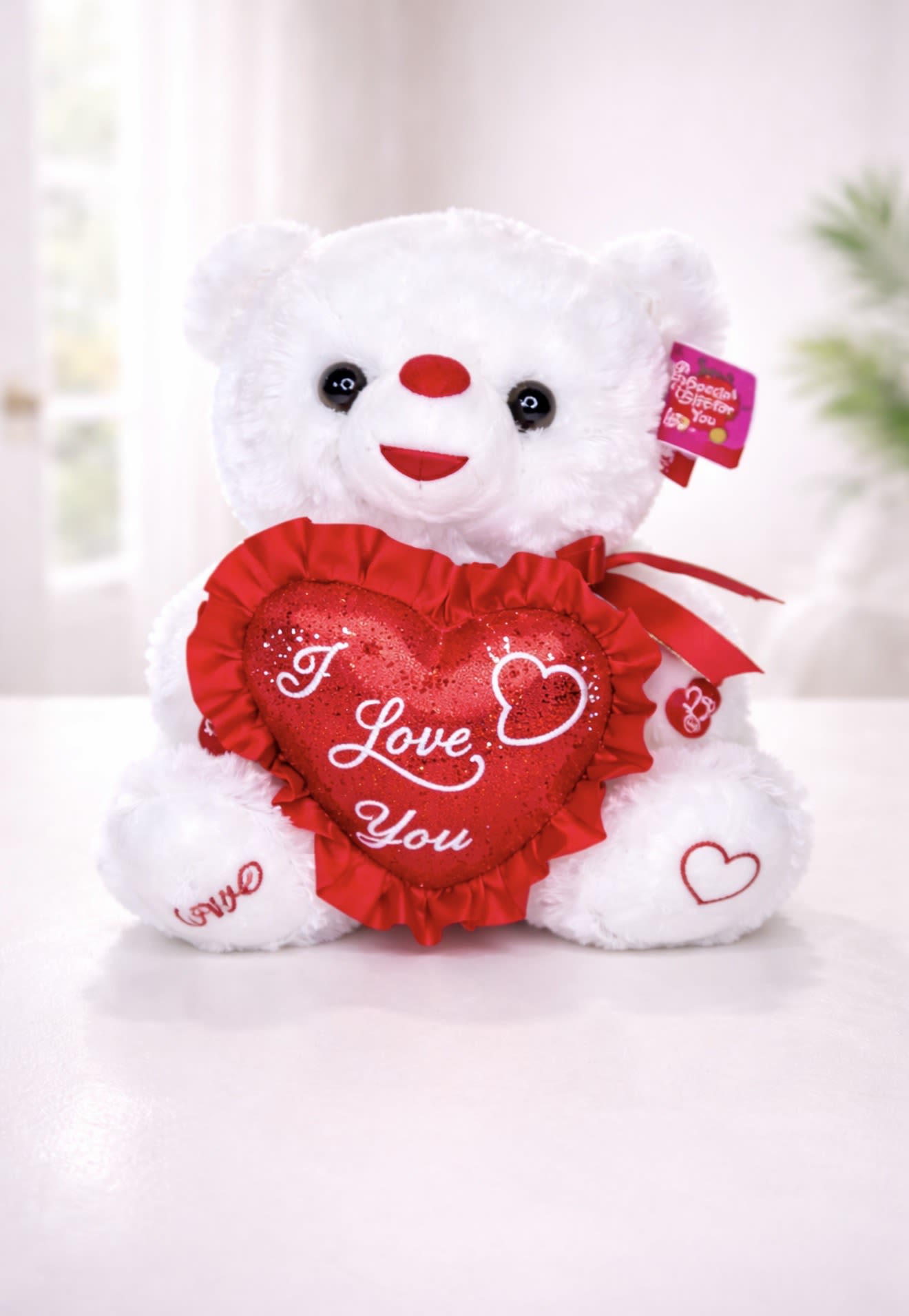10” Sweetheart Love Teddy Bear - Romantic Teddy Bear Gift in Alpharetta, GA 30022  Make your flower delivery even more special with our Sweetheart Love Teddy Bear. This soft white plush bear holds a shimmering red heart embroidered with “I Love You,” making it the perfect romantic gift for Valentine’s Day, anniversaries, birthdays, or just because.  Beautifully designed with embroidered heart details and a satin accent, this teddy bear pairs perfectly with roses, lilies, and luxury arrangements from AZ Flowers &amp; Gifts.  Available for same-day gift delivery in Alpharetta, GA 30022 and surrounding areas.  Add this romantic teddy bear to your order today and create a gift they’ll never forget. 