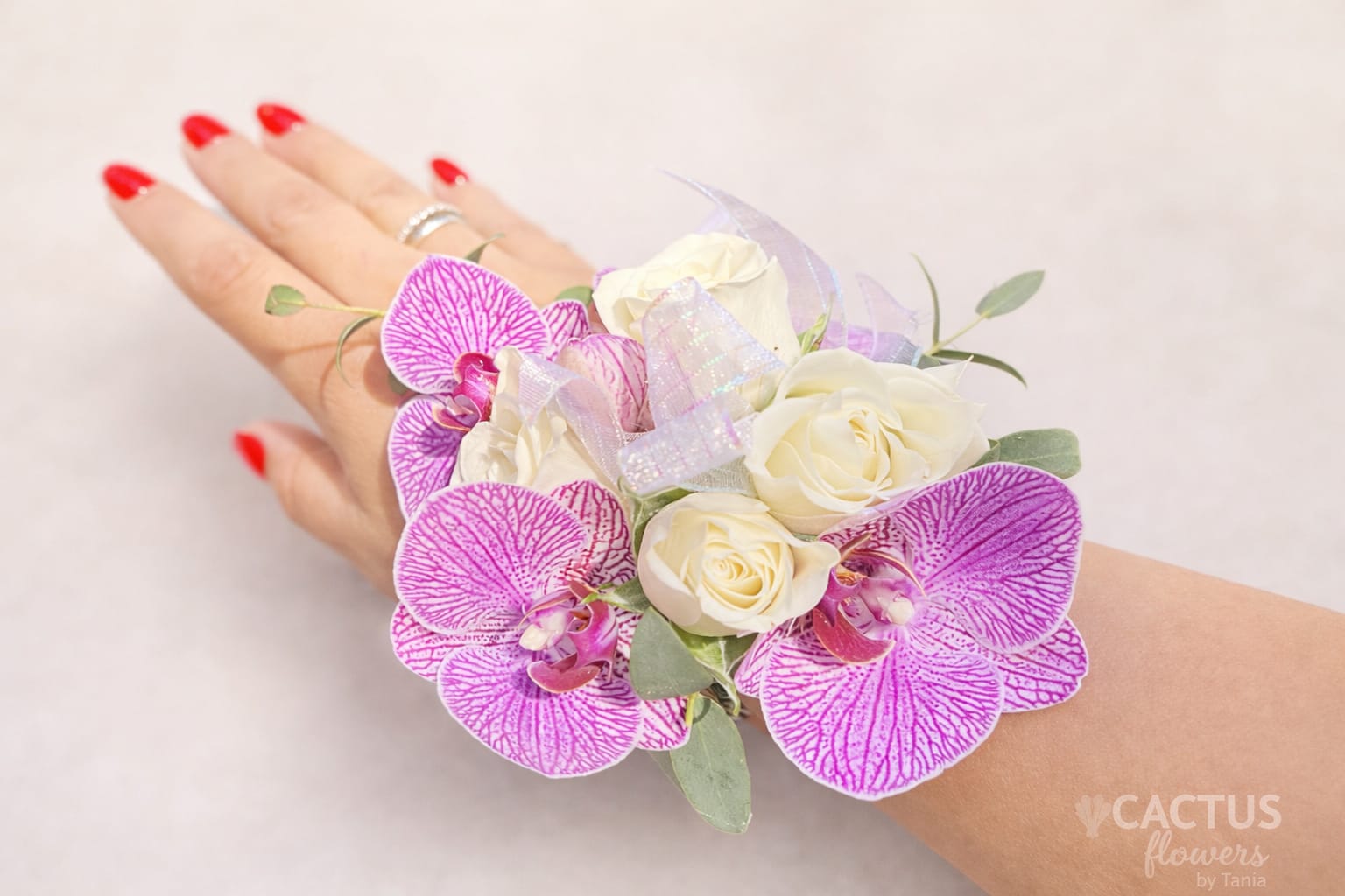 The Orchid Romance coursage  - Elegant handcrafted wrist corsage featuring premium purple orchids and ivory roses. Perfect for proms, weddings, quinceañeras, and special celebrations.  Soft. Elegant. Unforgettable.  Handcrafted with intention and signature style by Cactus Flowers by Tania.