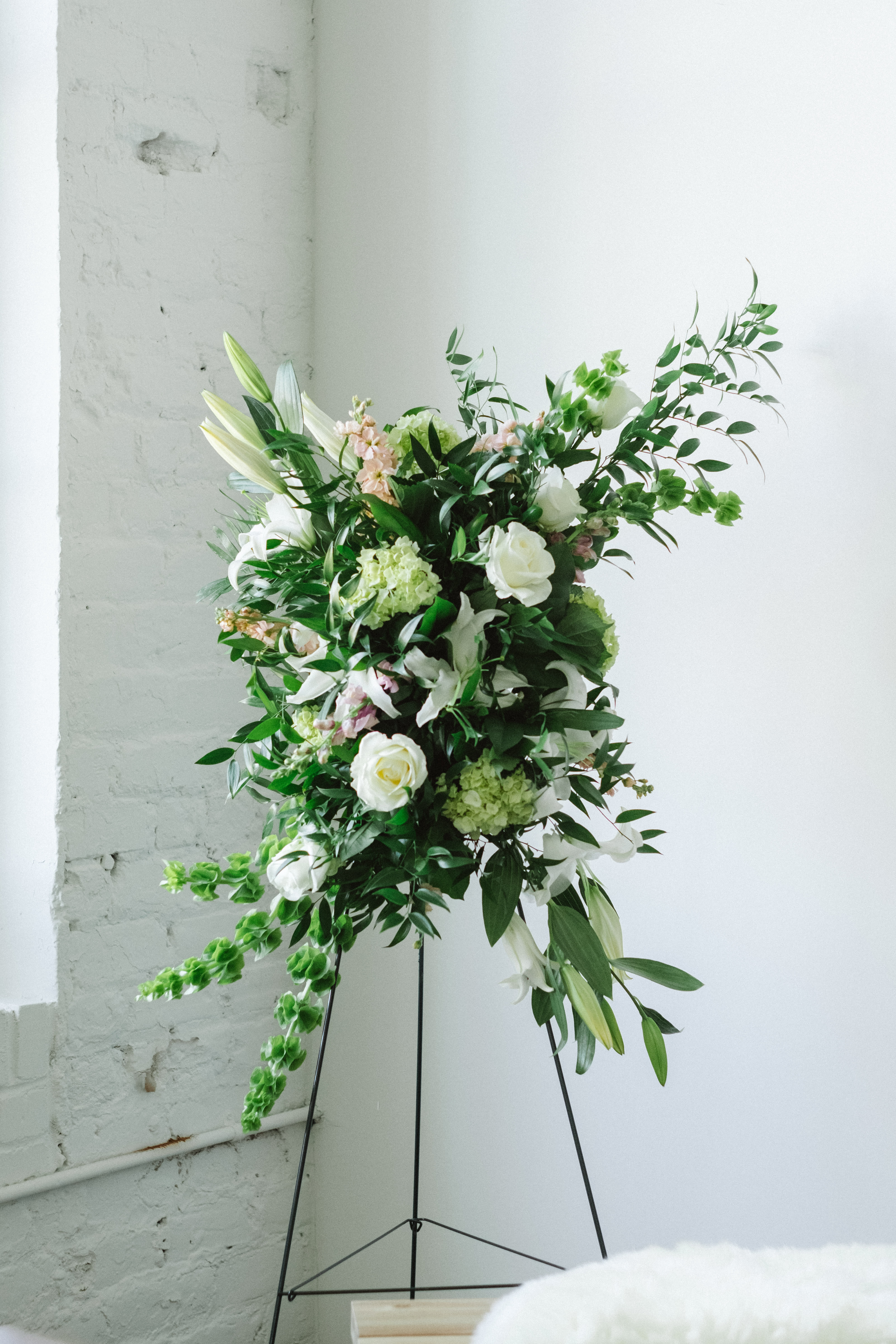 Standing Sympathy Spray - Standing floral spray made in a classic traditional style, a great way to celebrate a life. Delivered with stand to funeral home, church or graveside.  Please include funeral information in 'special notes' section when ordering.  **Same day delivery may not be guaranteed, call our shop to be sure we can fulfill your order.*** 