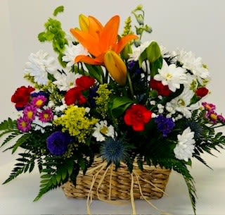Basket of Spring Blooms - Sweet upcycled basket - (styles may vary)  filled with Seasonal blooms in pastel colors.