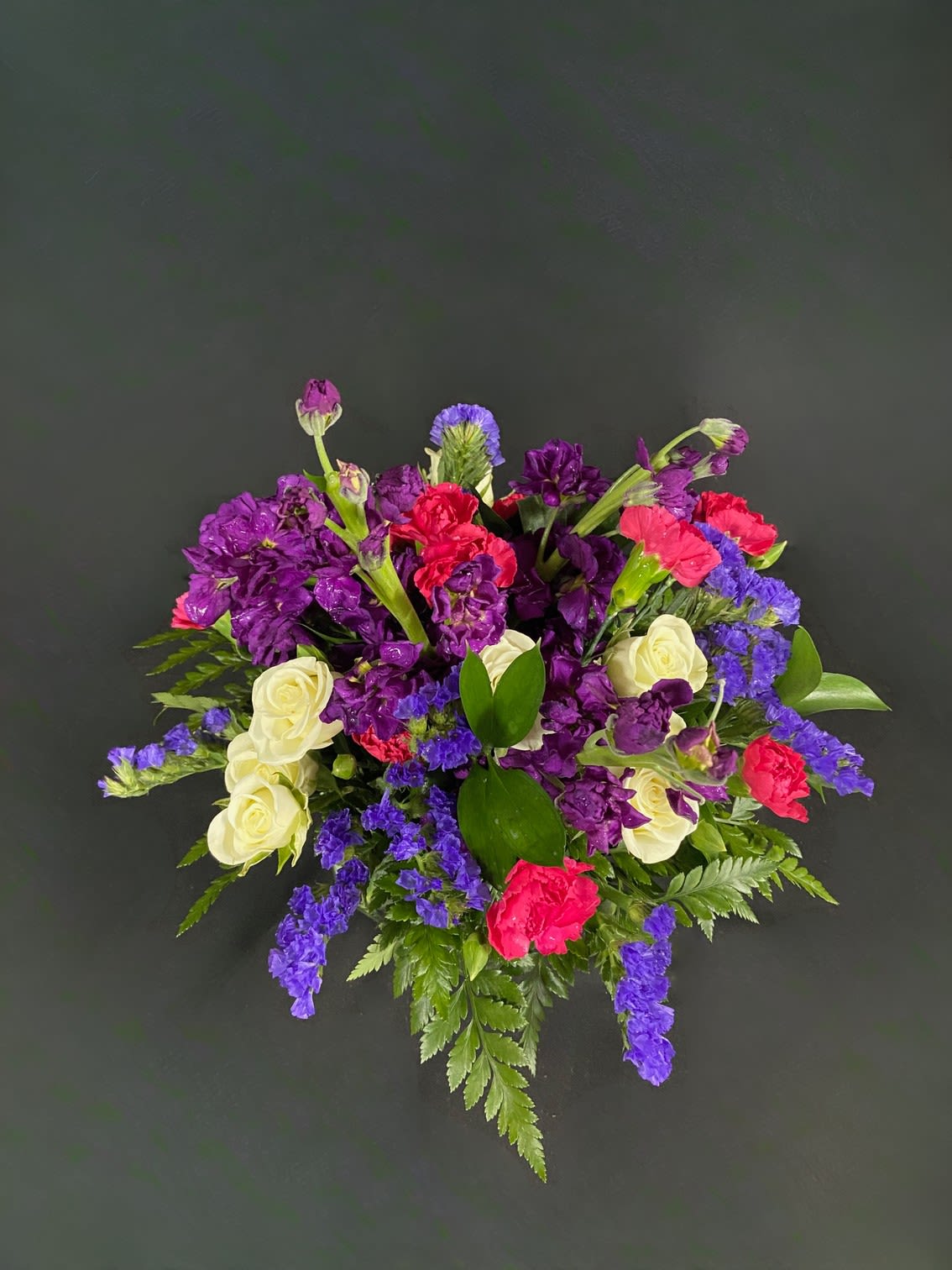 Twist and Shout - Flowers are fun! Especially when they look like this! Featuring sweet-smelling stock, spray roses, and carnations, this arrangement is a great surprise for Best Friends Day, Sister Day, or just because.