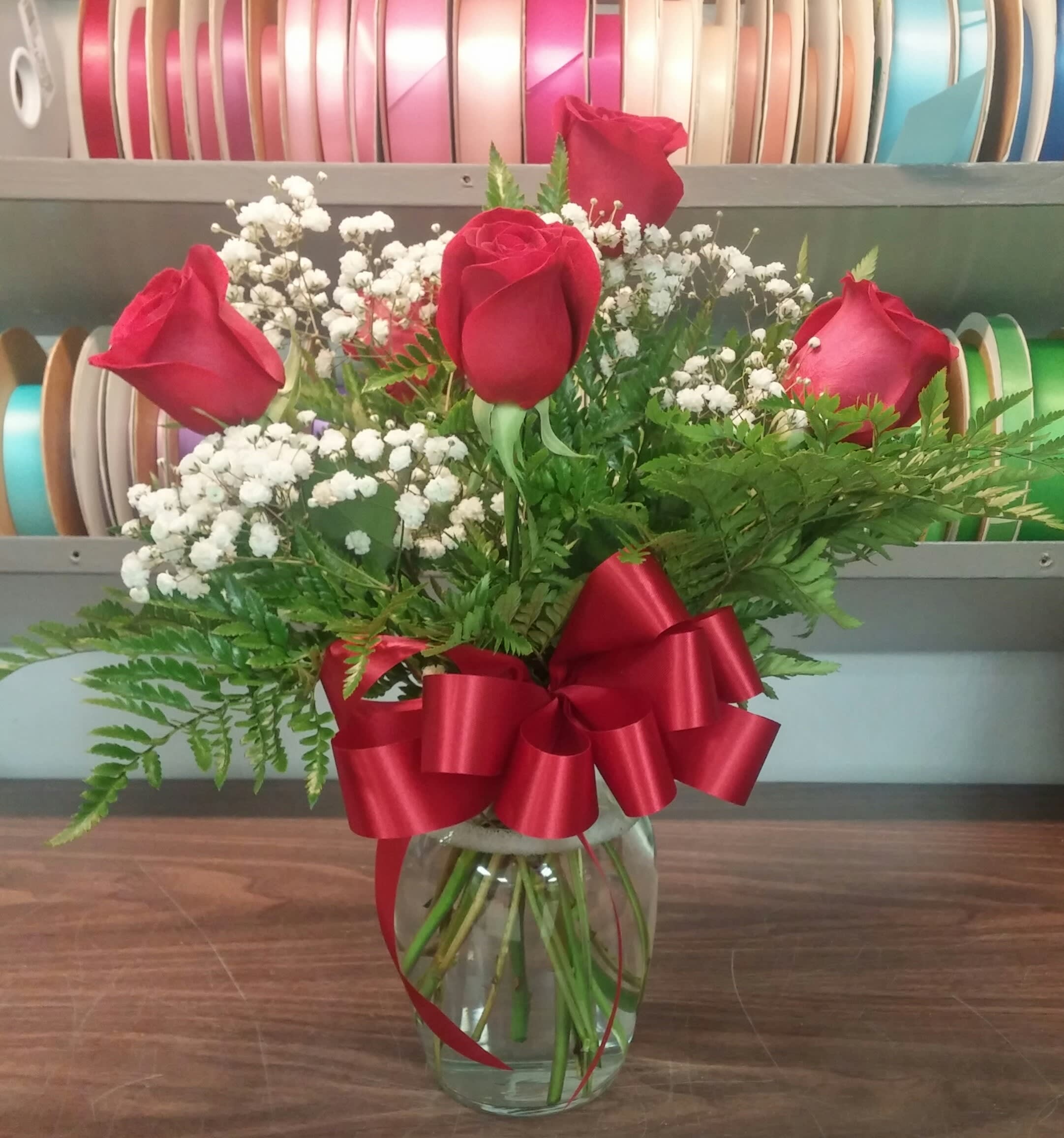 6 Red Roses - 6 Red Roses arranged in a clear vase with greenery and Babies Breath... classic and beautiful