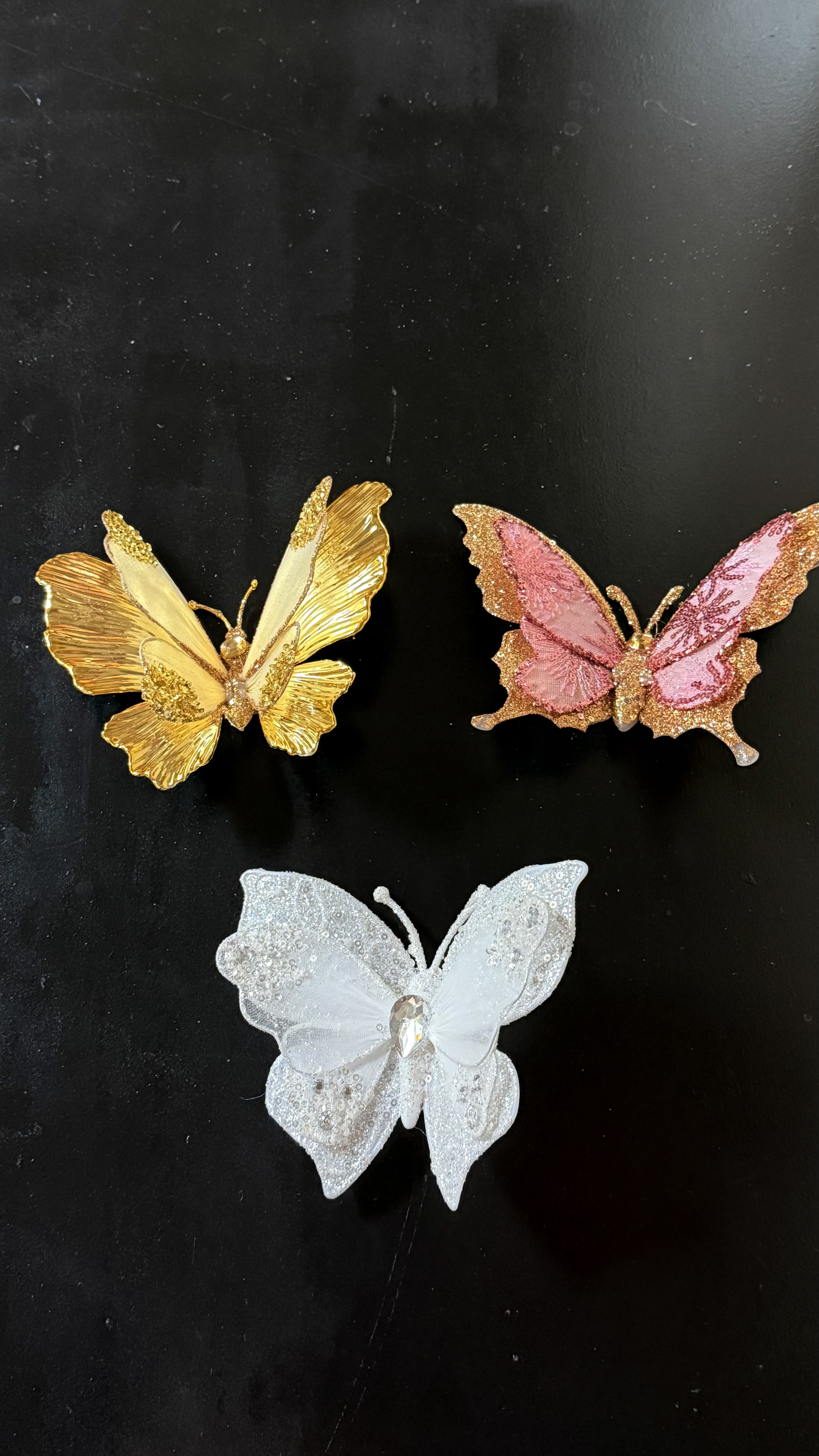 Enchanted Butterfly  - Each butterfly is beautifully crafted with shimmering details, glitter accents, and delicate wings that add a magical, whimsical feel to your blooms. Available in gold, pink, and pearl white, these butterflies add movement, sparkle, and a touch of fantasy—making your arrangements even more unforgettable. Perfect for birthdays, anniversaries, quinceañeras, weddings, and any moment that deserves a little extra enchantment. 