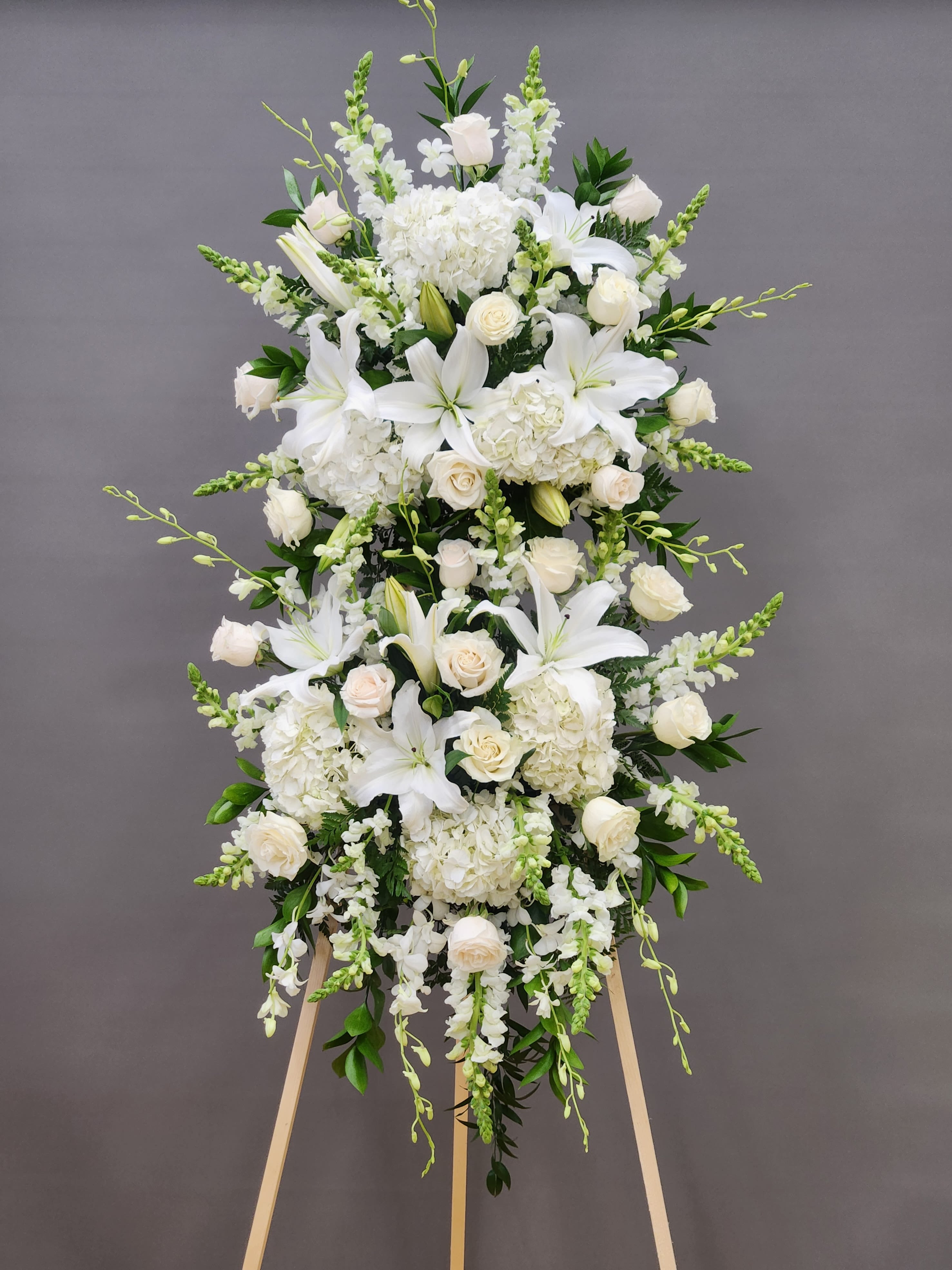 Wonderful Soul Spray - Celebrate life's most meaningful moments with the Wonderful Soul Spray—a graceful, luxurious arrangement crafted with premium white blooms. This double-layer design showcases a stunning blend of roses, hydrangea, spray roses, snapdragons, lilies, and dendrobium orchids, each flower hand-selected for its beauty and elegance. Perfect for honoring cherished memories or expressing heartfelt sentiments.  EXTRA LARGE SIZE ONLY: 32" WIDE BY 52" TALL