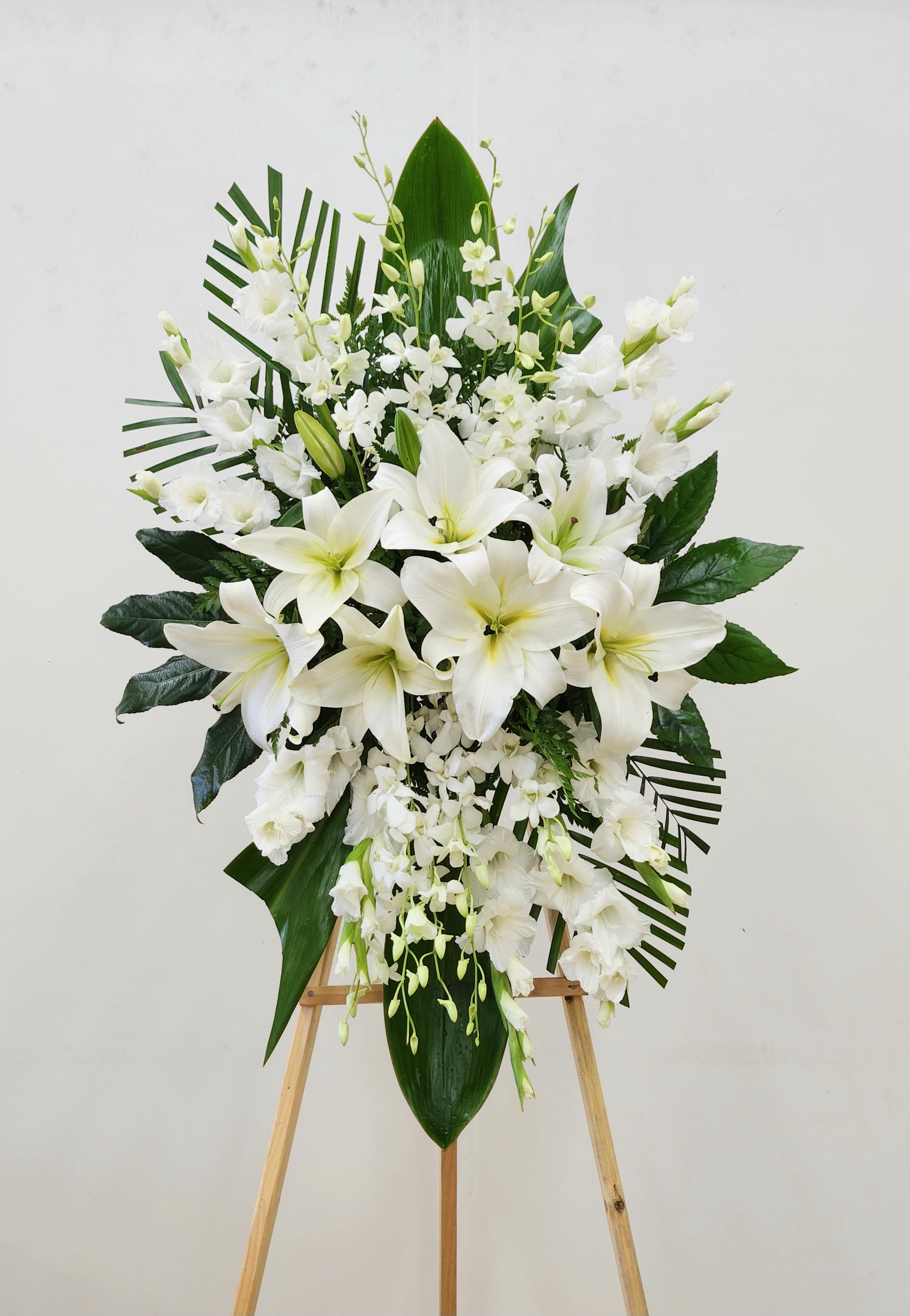 Thoughts of You Spray - The Thoughts of You Spray offers a beautifully handcrafted tribute designed to bring comfort and peace during difficult times. Thoughtfully arranged, this elegant standing spray serves as a sincere expression of deepest sympathy, providing solace and support to those who need it most.  Approximate Size without Stand: 32"x46"  ONE SIZE ONLY