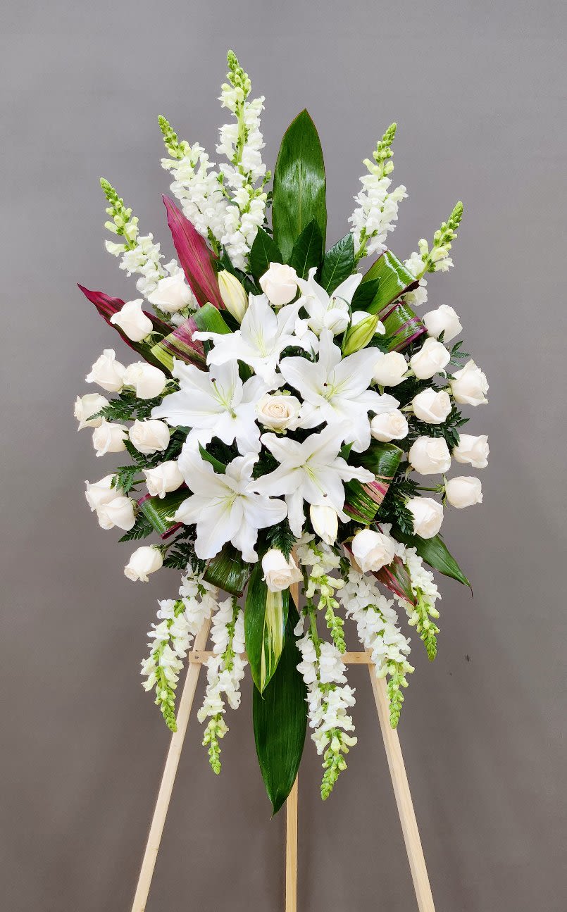 Treasured Friend Spray - Celebrate lasting bonds with the Treasured Friend Spray, a heartfelt way to say farewell while honoring enduring friendship. This elegant arrangement conveys gratitude and love, offering comfort and support during moments of parting. Perfect for expressing that true friendships never fade, it brings warmth and timeless beauty to any farewell occasion.  Approximate Size Without Stand:  Standard: 20" x 28"  Deluxe: 25" x 36  Premium - AS PICTURED: 30" x 46"