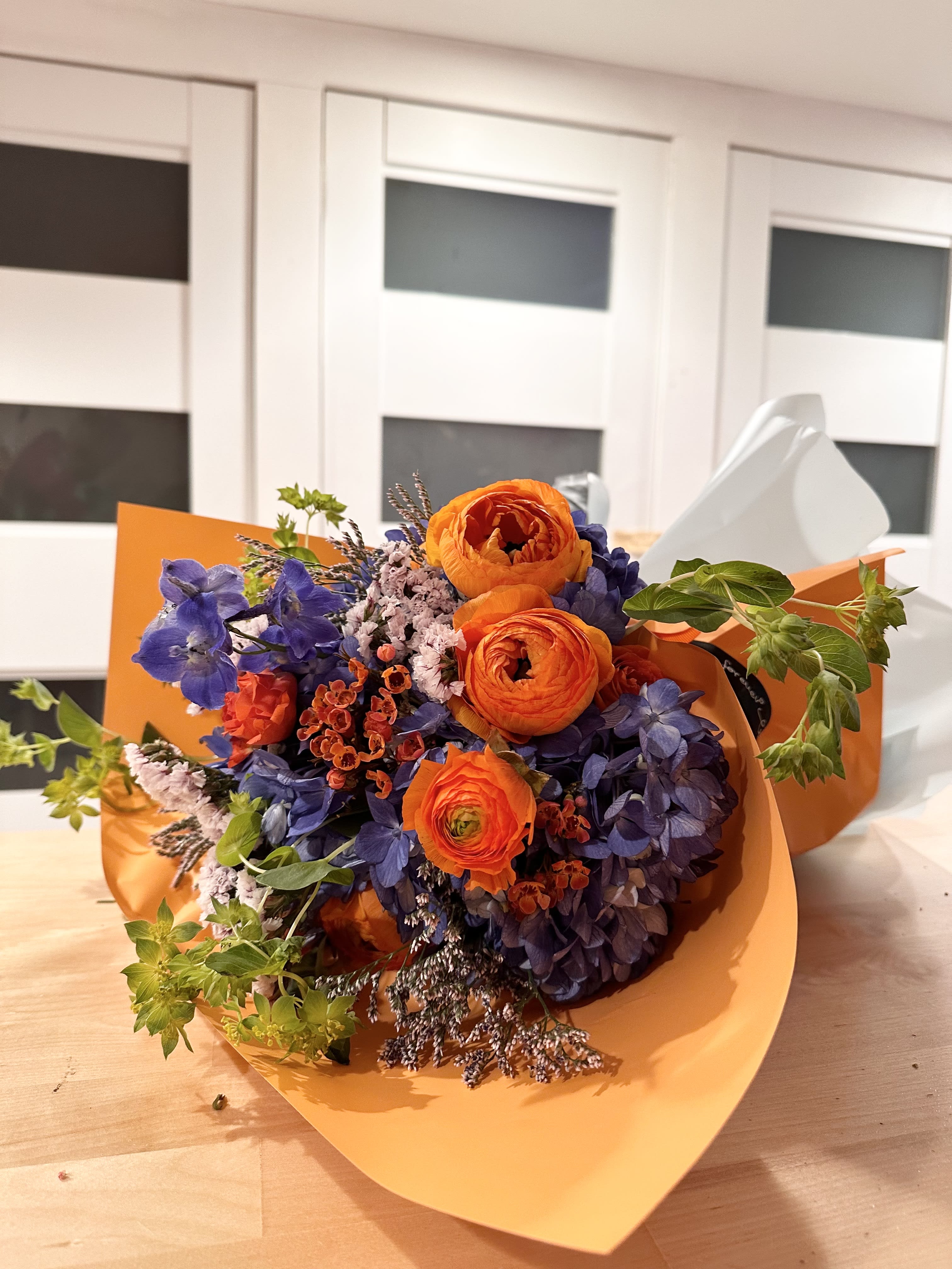 Vibrant Thing! - A mix of bright ranunculus, hydrangeas and other supporting flowers create a seasonal love fest! Well tailored with high quality wrapping. 