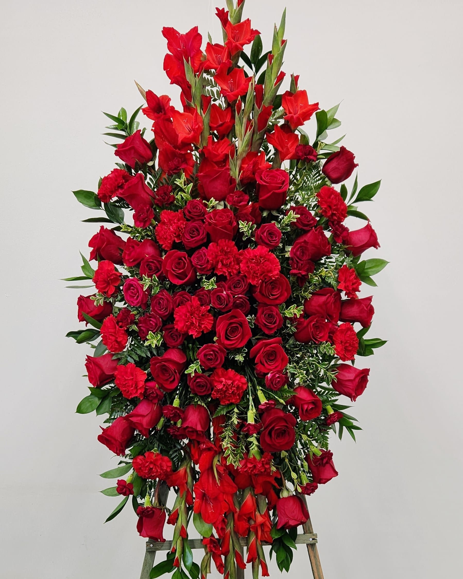 With Love and Sympathy Spray - Express your heartfelt condolences with the With Love and Sympathy Spray. Designed to honor and remember loved ones, this unique&nbsp; spray offers a thoughtful way to share your deep love for the departed and provide comfort during difficult times. Its soothing essence helps create a peaceful atmosphere, supporting healing and remembrance.  Approximate Size Without Stand:  Standard: 20" x 25"  Deluxe: 25" x 32"  Premium - As Pictured: 32" x 42"