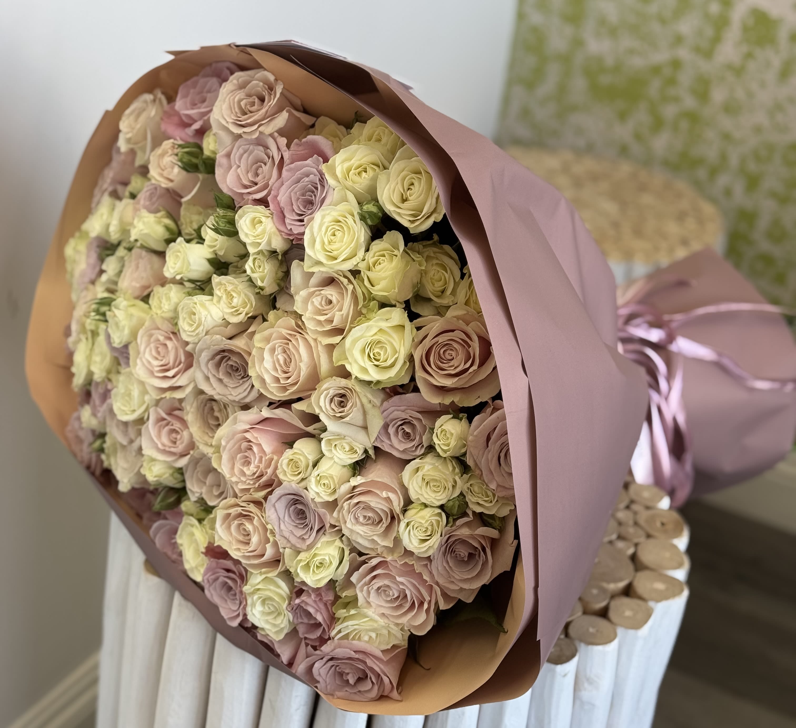 Blush Harmony Rose Bouquet  - Surprise mom with this romantic hand-tied big bouquet filled with blush, cream, and pale pink roses. Wrapped in soft mauve paper, it’s an elegant and classic Valentine’s Day flower gift that never goes out of style.