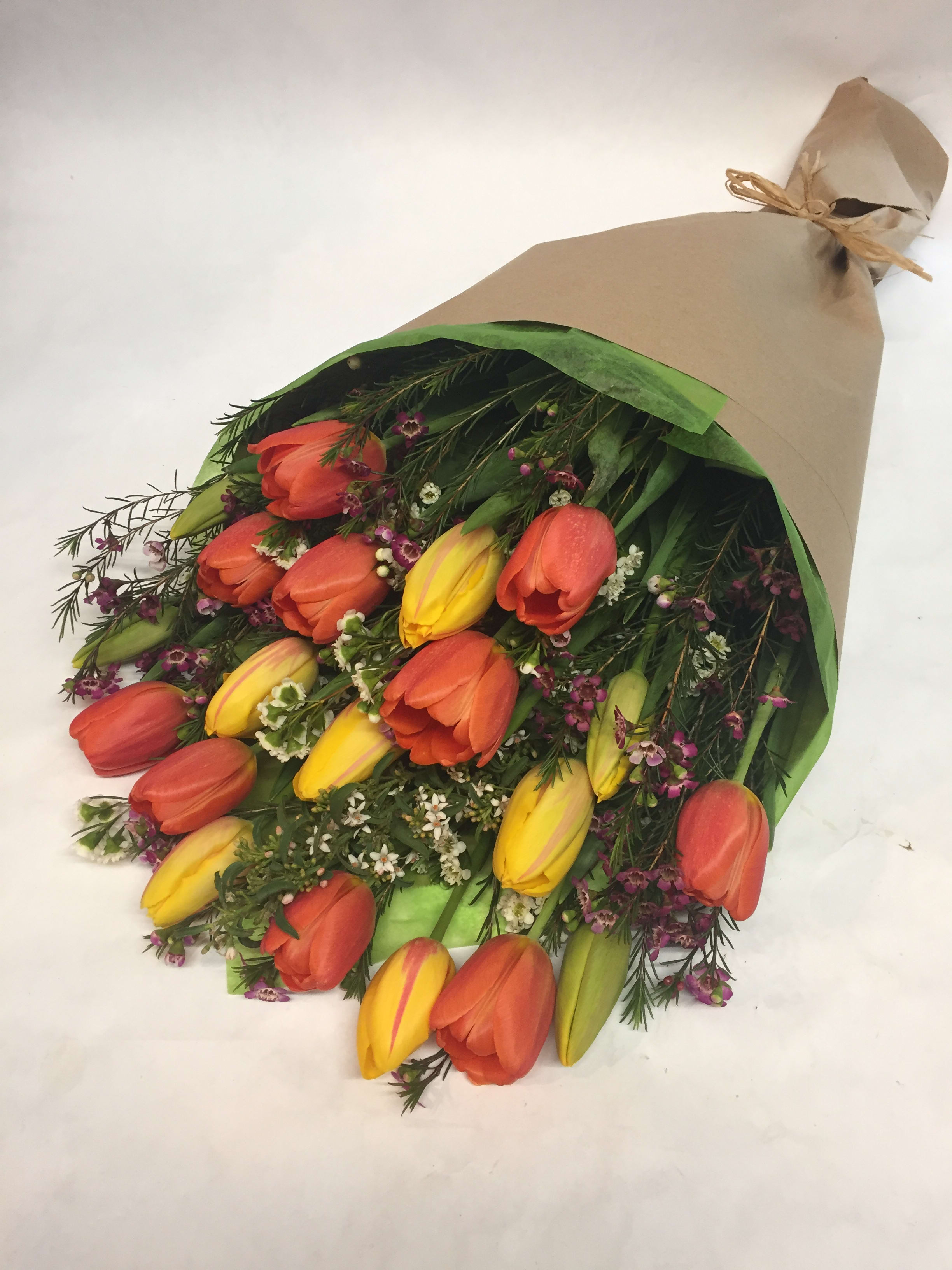 Tulip Explosion - This variety of tulips comes with wax flowers and other seasonal greenery.  (Some flowers may be subject to change depending on the season. We will contact you with available flower substitutions; please contact us with specific questions if you are concerned with flower availability, thanks!)  FEATURED ARRANGEMENT: $78.75   - 20 stems  tulips with wax flowers (REGULAR PRICE);   $118.75 - 30 stems tulips with wax flowers  (Deluxe Price);  &amp;158.75  -  40 stems tulips  (Premium Price)   