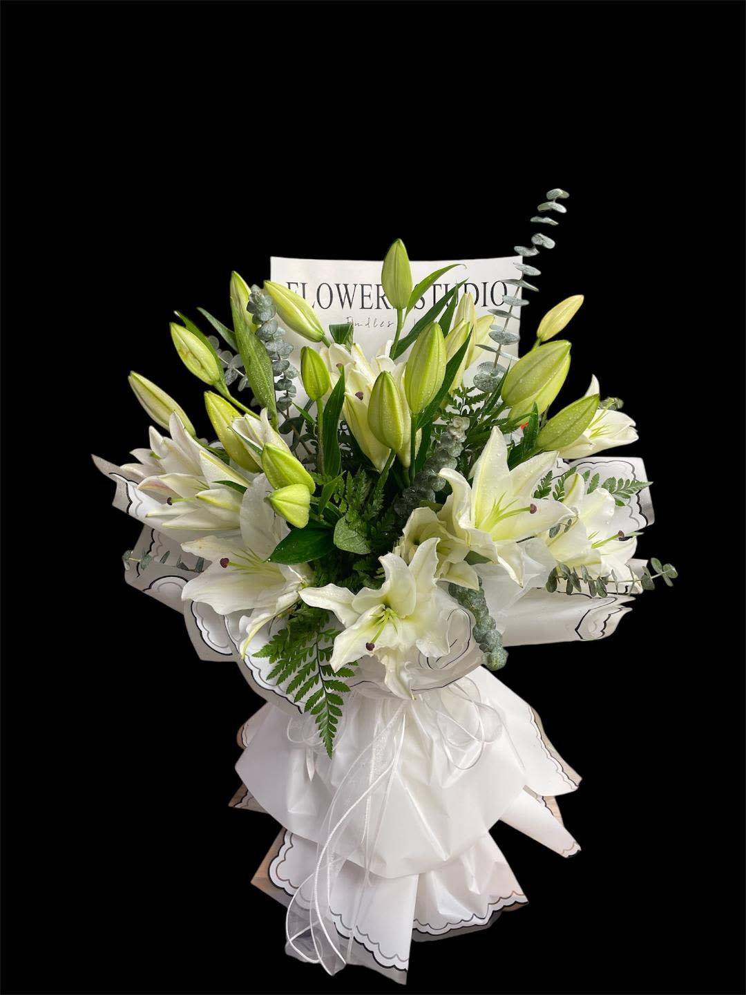 Queen Sweet Lilies 12 - In some instances, our photo may represent an overall theme or look and include a one-of-a-kind vase which cannot be exactly replicated.  Although the actual bouquet may not precisely match the photo, its temperament will. Occasionally, substitutions of flowers and/or containers happen due to weather, seasonality and market conditions which may affect availability. If this is the case with the gift you’ve selected, we will ensure that the style, theme and color scheme of your arrangement is preserved and will only substitute items of equal value or higher value.  If any design elements are of major importance to your order, please include them in the florist instructions at checkout or contact us to ensure availability. Flower Care &amp; Guarantee Policy  We guarantee the freshness of our flowers for 24 hours from the time they leave our shop.  Please note that because flowers are natural products, some blooms may open fully while others may not. This is a natural variation.  To help your flowers last longer:  For cut flowers: Trim the stems by 1 inch every 2–3 days and place them in fresh water. For arrangements in wet foam: Add 1 cup of water to the foam every couple of days to keep the flowers hydrated. After 24 hours from leaving the shop, it becomes the customer’s responsibility to care for the flowers properly.  Thank you for your understanding and for choosing our shop!
