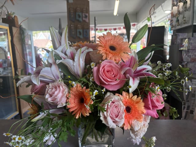 Thankful bliss - Soft peach colors, with pink roses, soft colors, white and pinks, in a cylinder vase. 