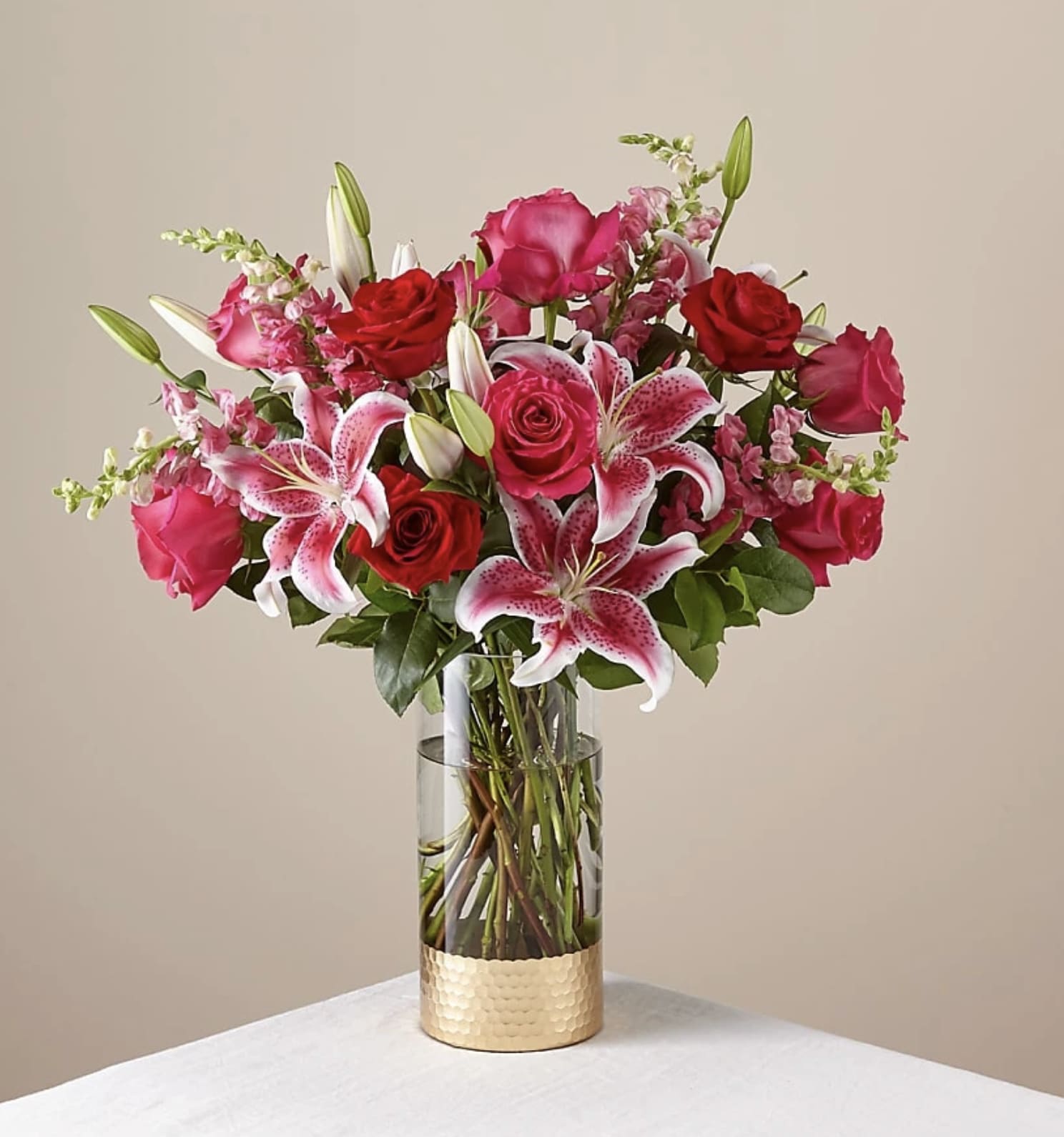 Always You Luxury Bouquet - Tell your one true love that you were always meant for each other with this bouquet of blooming flowers. Red &amp; hot pink roses, lilies &amp; snapdragons combine into the stunning bouquet your one true love deserves. 