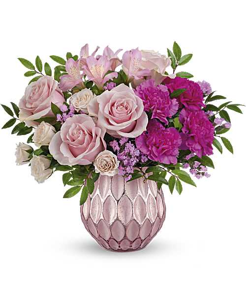 Pink roses and carnations arranged in a pink textured vase