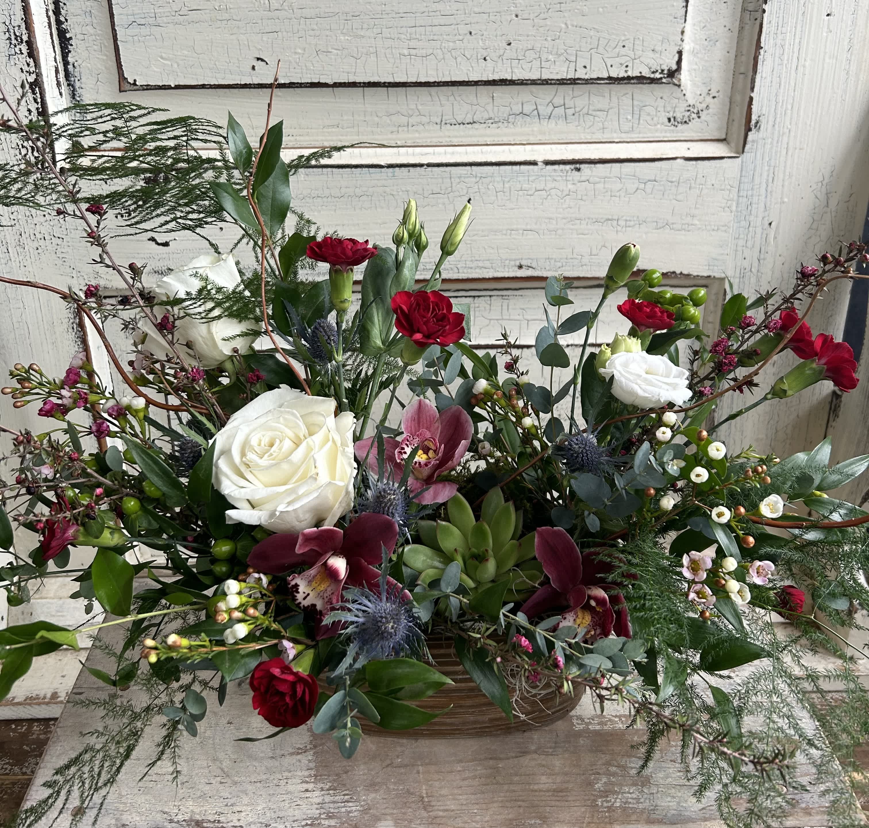 Blooms &amp; Succulent Tin - A metal tin or birch bark container is designed with an assortment of fresh flowers and an easy care succulent plant as a focal point. Colors may vary as each arrangement is unique and dependent on the best blooms in stock each week. Deluxe version will be designed in a larger container and have more plants.