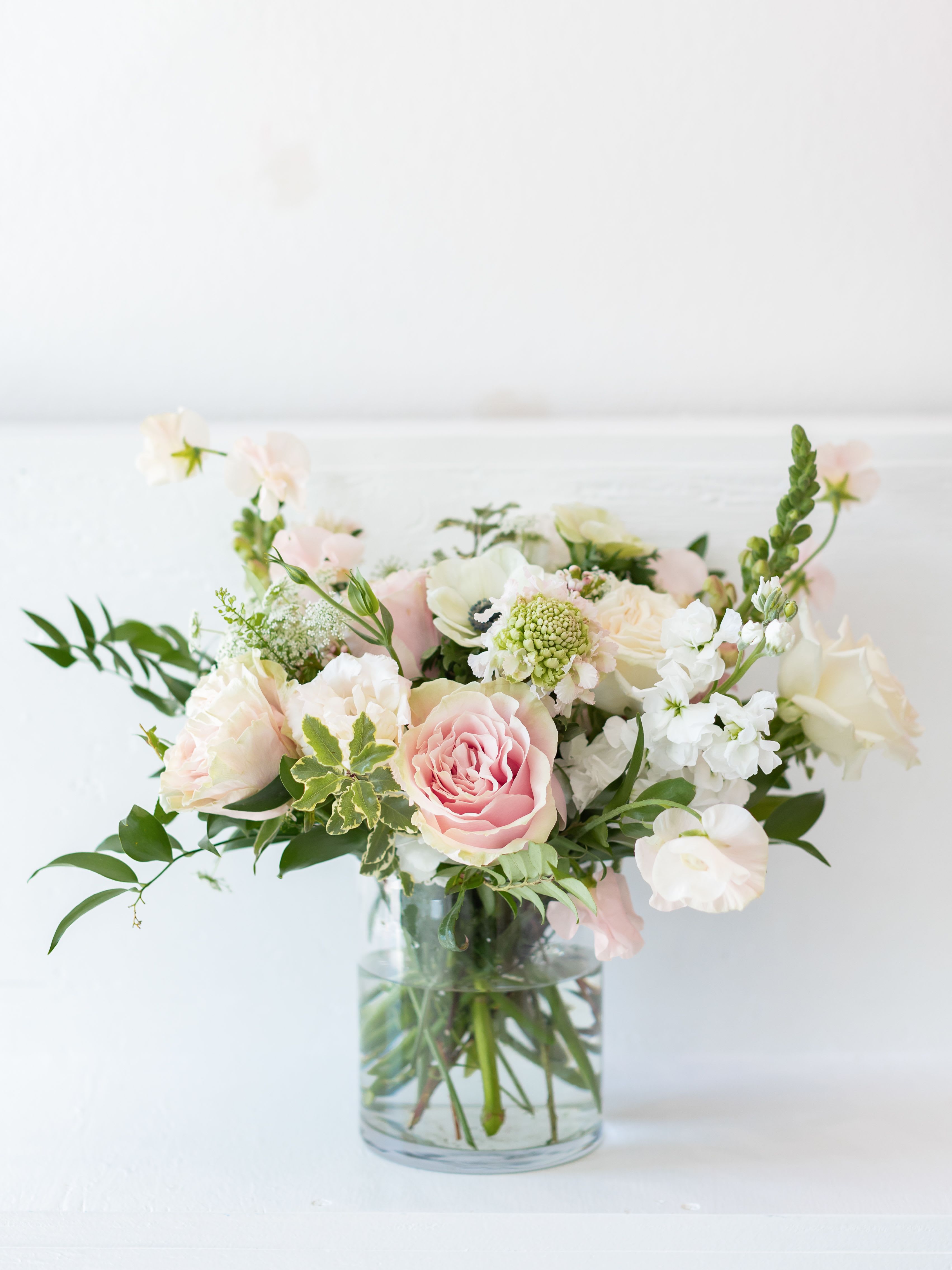 Designer Choice: Garden - Let our designers create a one-of-a-kind arrangement in Studio C’s signature garden style. This lush, airy design features a seasonal selection of premium blooms arranged with soft movement and natural elegance. Each piece is thoughtfully composed using the freshest flowers available, allowing us to highlight beautiful textures, refined color palettes, and the artistry that defines Studio C Florals.  Perfect for birthdays, celebrations, or simply sending something beautiful without overthinking it. Every arrangement is unique, but always designed with our elevated coastal aesthetic and attention to detail.  Flower varieties and exact colors will vary based on seasonal availability while maintaining the overall garden-inspired style.