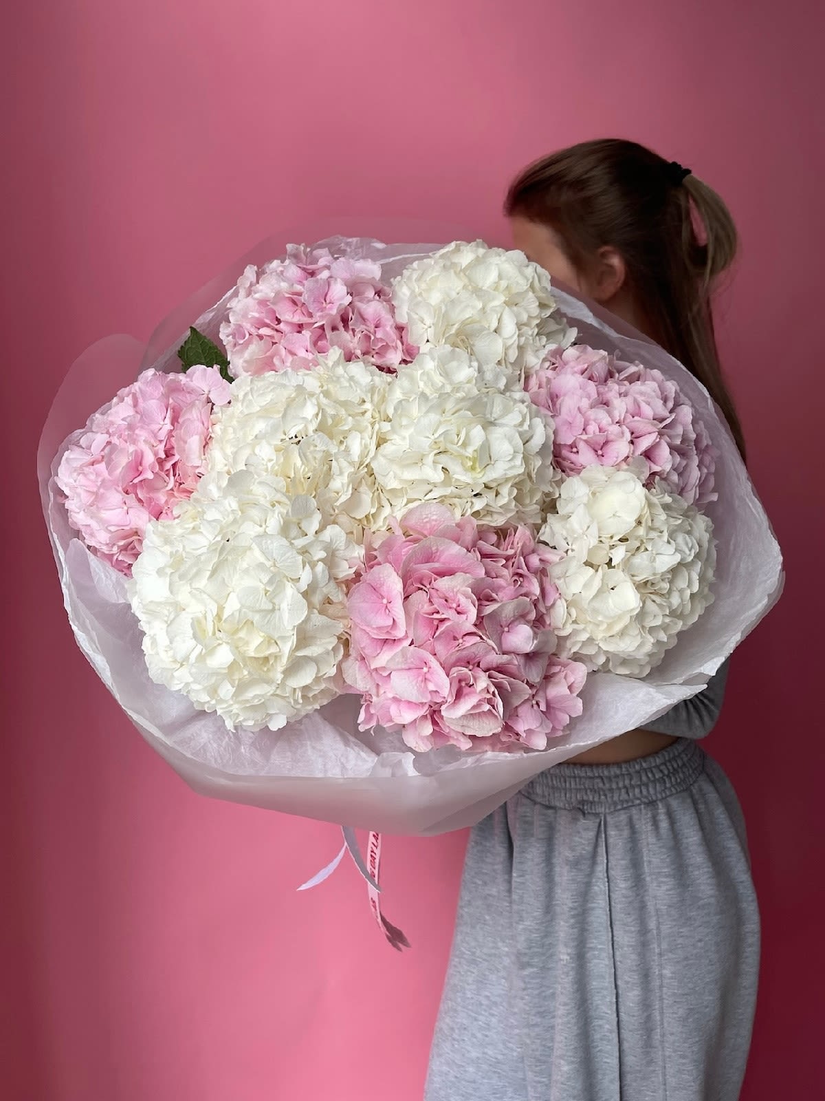Hydrangea Harmony - A lush mono-bouquet of white and pink hydrangeas — a graceful blend of purity and romance. The white hydrangea brings elegance and softness with its airy, voluminous blooms, while the pink adds a gentle warmth and delicate contrast.  Composition: Hydrangeas (white and pink)