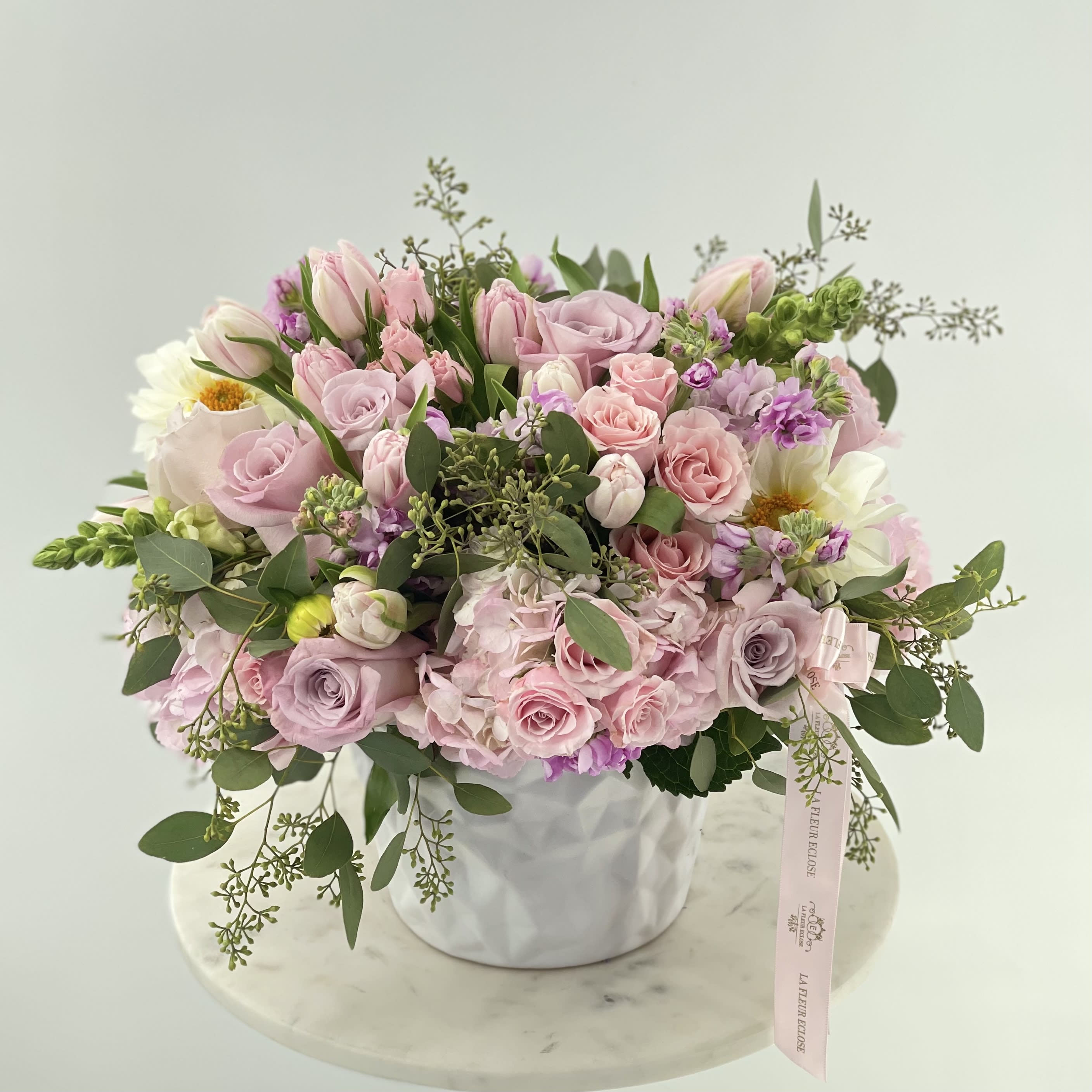 Mini Cuteness  - Small white ceramic vase with hydrangeas, roses, tulips, dahlia ,spray roses and lisianthus.                Standard – pictured  Deluxe – the amount of flower will be bigger. We will also put more premium flowers into the arrangement. Premium – the vase size will be changed for the bigger one and a lot of premium flowers will be added to the arrangement.           