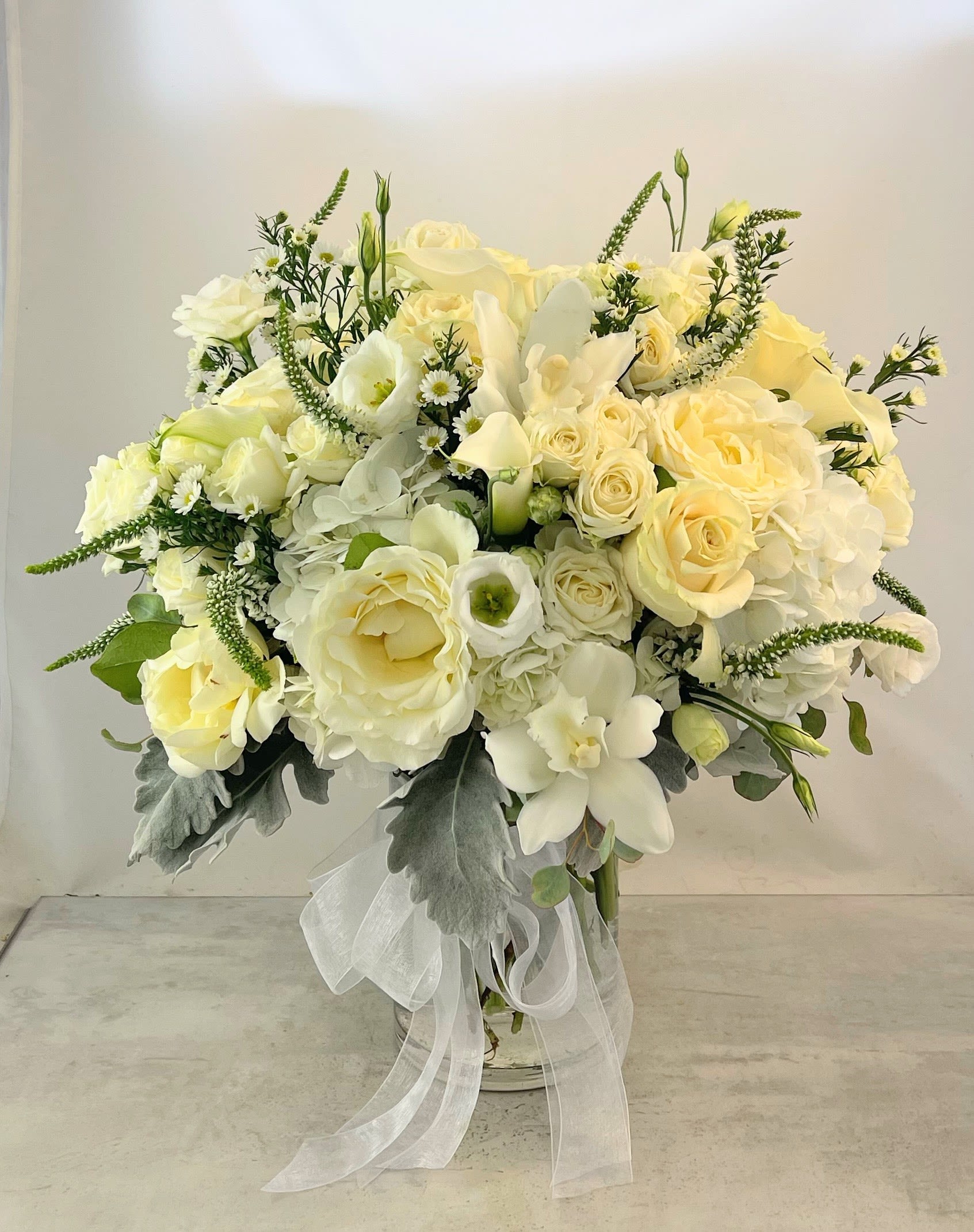 Pure Serenity Bouquet - Beauty, grace and elegance are embodied in this artfully designed bouquet. Whether expressing  love and admiration or comfort and sympathy, this bouquet will be cherished by your friends and loved ones and fill them with fond thoughts of you.