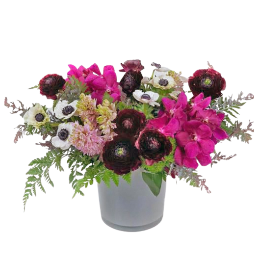 Ranunculus, anemone, hyacinth and orchids - This arrangement is made with a nice assortment of spring flowers , including Hyacinth, Ranunculus, Anemone, Mokara Orchids and interesting greenery. Color palate might be different. 