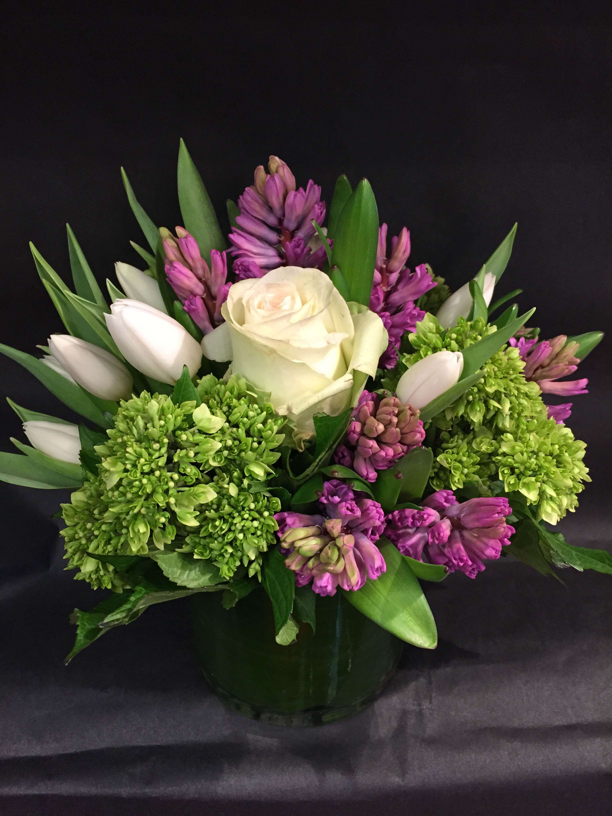 spring is eternal - Tulips, hyacinth, hydrangea and roses complete this contemporary piece.