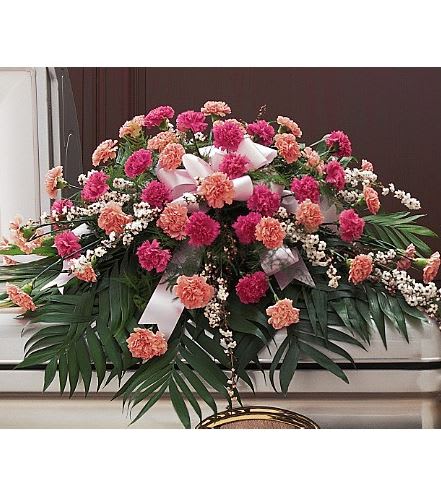 TF198-4 Delicate Pink Casket Spray - This classic half-couch casket spray with its dark and light pink carnations will leave no doubt about the depth of your feelings. One casket spray arrives decorated with two shades of pink carnations and accented with leptospermum. Approximately 48" W x 36" H 