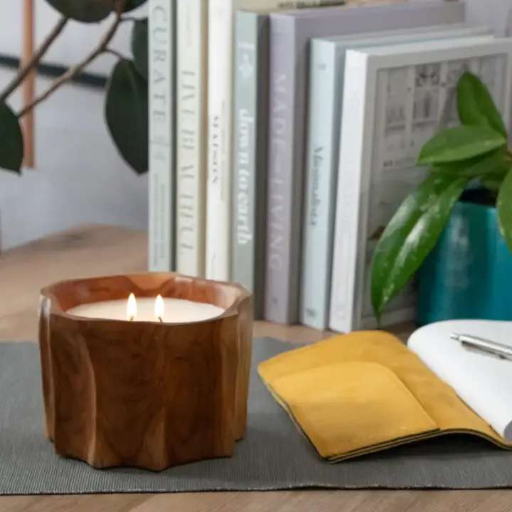Petite Teak Organic Bowl Candle - Description Naturally shaped and with a beautifully organic edge, this petite bowl is made from gorgeous natural teak wood and filled with a soy wax blend with a subtle palo santo fragrance.    - Bowl dimensions: 5 - 6" diameter x 4" height - 30 hour burn time - 13 ounces - Subtle palo santo fragrance - There are slight variations from one to the next in colors and finish, which make these truly unique and one of a kind.  - Packaging: Wrapped in paper. Natural stems tied to ribbon. Stem styles may vary.