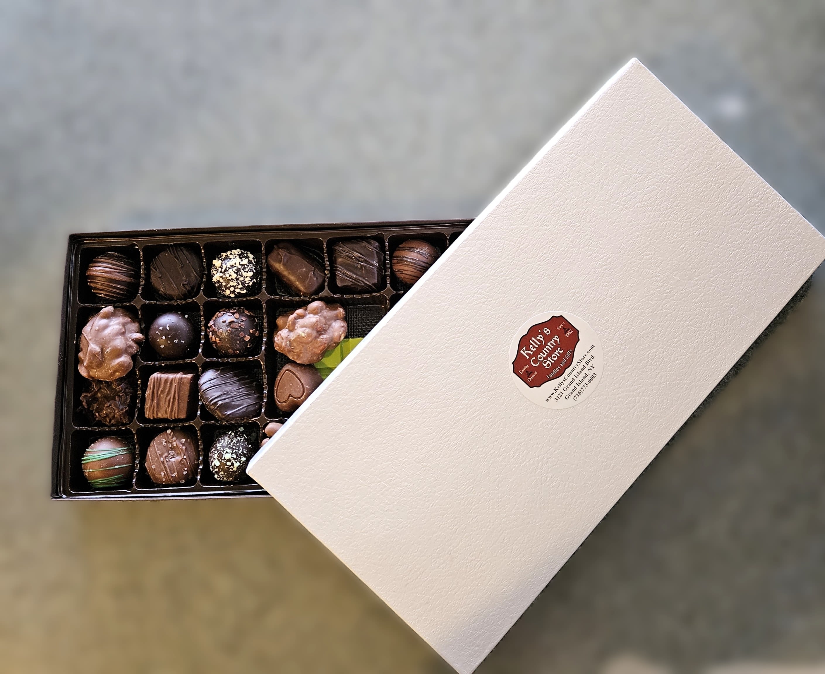 Kelly's Country Store One Pound Assorted Chocolates (1lb) - Made locally at Kelly's Country Store, right here on Grand Island!  An assortment of their finest chocolates, with a mixtures of nut clusters, truffles, caramels, creams and jellies with both milk and dark flavors.! A Western New York staple and favorite!