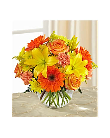 Vibrant Views Bouquet - Stunning yellow Asiatic lilies, chrysanthemums and solidago are brought together with orange roses, gerbera daisies and carnations, all beautifully accented with lush greens, to create an unforgettable fresh flower arrangement. All flowers and colors are subject to change due to availability.    FCB3-4952S