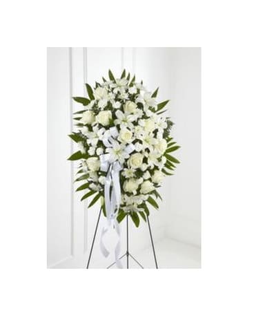 Exquisite Tribute Spray - The Exquisite Tribute Standing Spray is an elegant display of sweet serenity. White roses Asiatic lilies chrysanthemums and mini carnations are artfully arranged amongst emerald palm fronds and lush greens. Accented by white satin ribbon and standing on a wire easel this standing spray is an outstanding way to honor the life of your loved one. Approximate Size: 32"h x 20"w   FCS6-4447