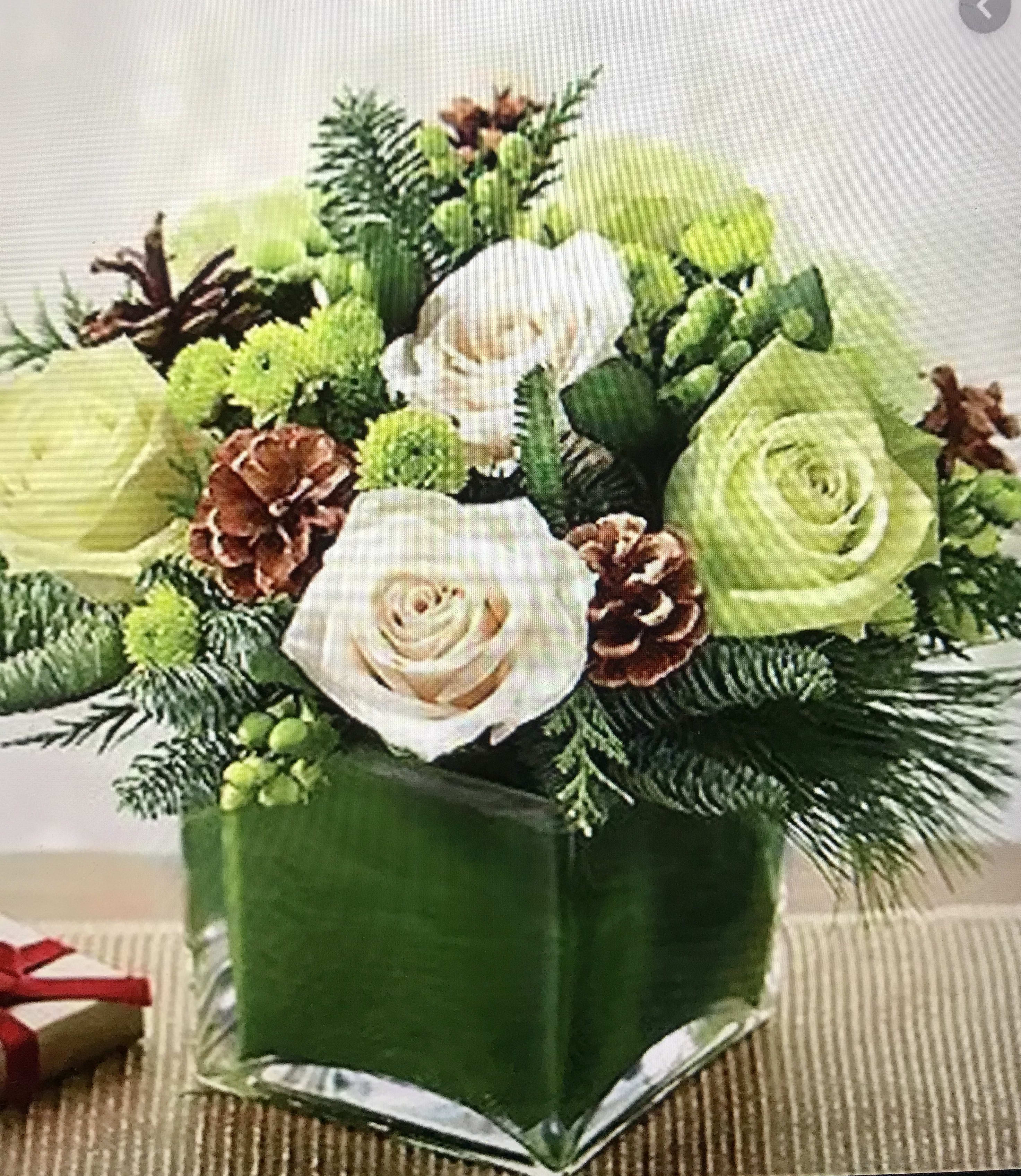 Just Friends - A Fresh Garden Serenade from Your San Francisco Florist Brighten any day with JUST FRIENDS, a cheerful and sophisticated arrangement that captures the effortless beauty of a sun-drenched garden. As your premier San Francisco Florist, Jane's Roses specializes in creating artisanal designs that balance modern chic with natural charm. This bouquet is the perfect gesture for a thoughtful "thank you," a birthday surprise, or simply to let someone know they are on your mind.  Zesty Greens and Soft Petals The JUST FRIENDS design is a refreshing study in crisp whites and vibrant chartreuse tones:  Lush White &amp; Cream Roses: Large, premium roses provide a classic and elegant focal point for the arrangement.  Vibrant Lime Green Mums: Playful, button-like pompon mums add a zesty pop of color and delightful texture.  Rustic Pinecone Accents: Deep brown pinecones are nestled among the blooms, offering a touch of woodland-inspired charm.  Fresh Winter Greenery: Sprigs of fragrant pine and cedar create a lush, textured base that enhances the garden-fresh feel.  Modern Minimalism Artfully presented in a square glass leaf-lined vase, this compact and stylish design allows the unique textures to take center stage. Trust the most creative San Francisco Florist to deliver this handcrafted expression of friendship and joy.